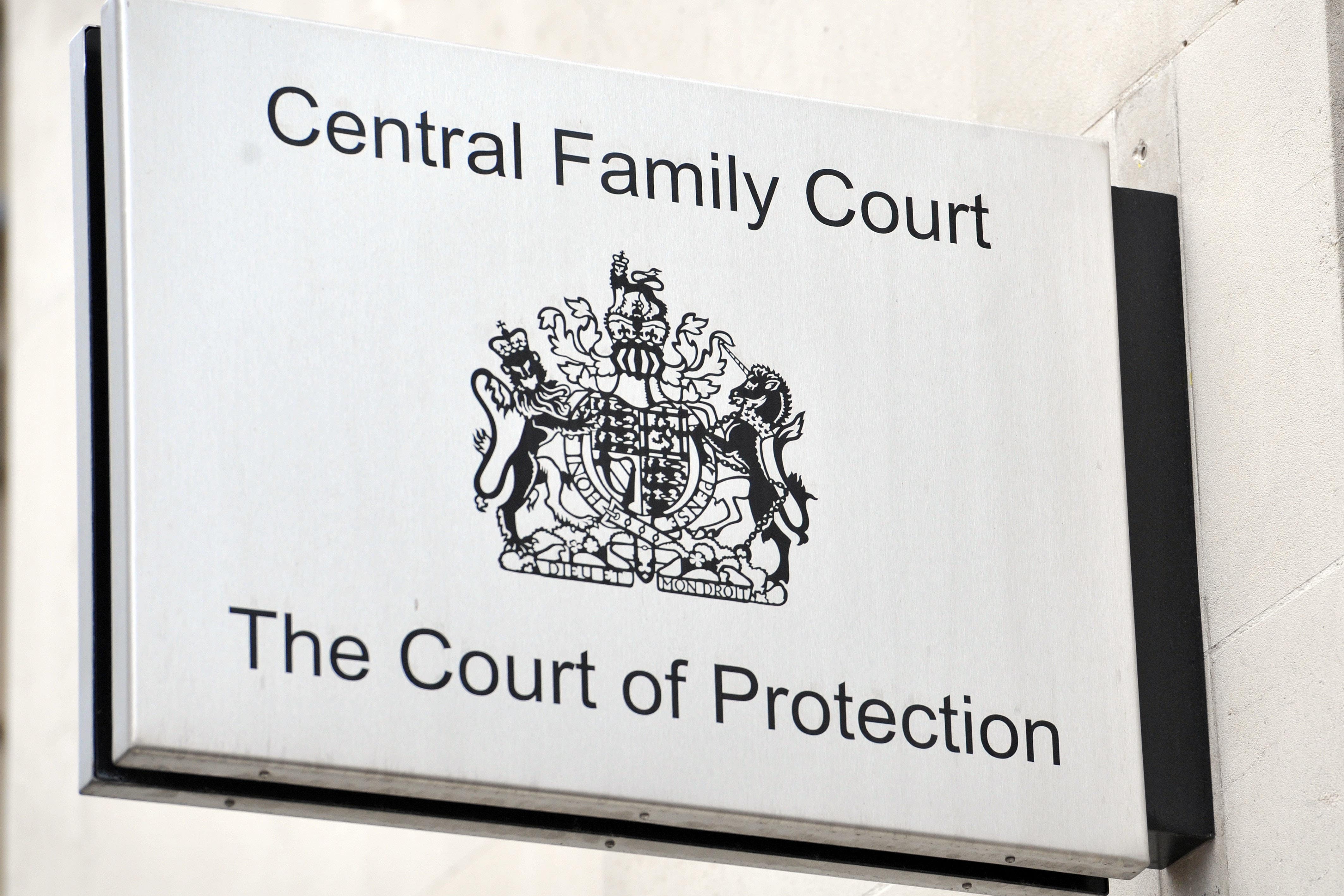 A a sign outside a Court of Protection building in London. Healthcare bosses have accused the parents and grandmother of a woman who suffers from a rare degenerative neurological condition of “tampering” with medical equipment. PA/Nick Ansell