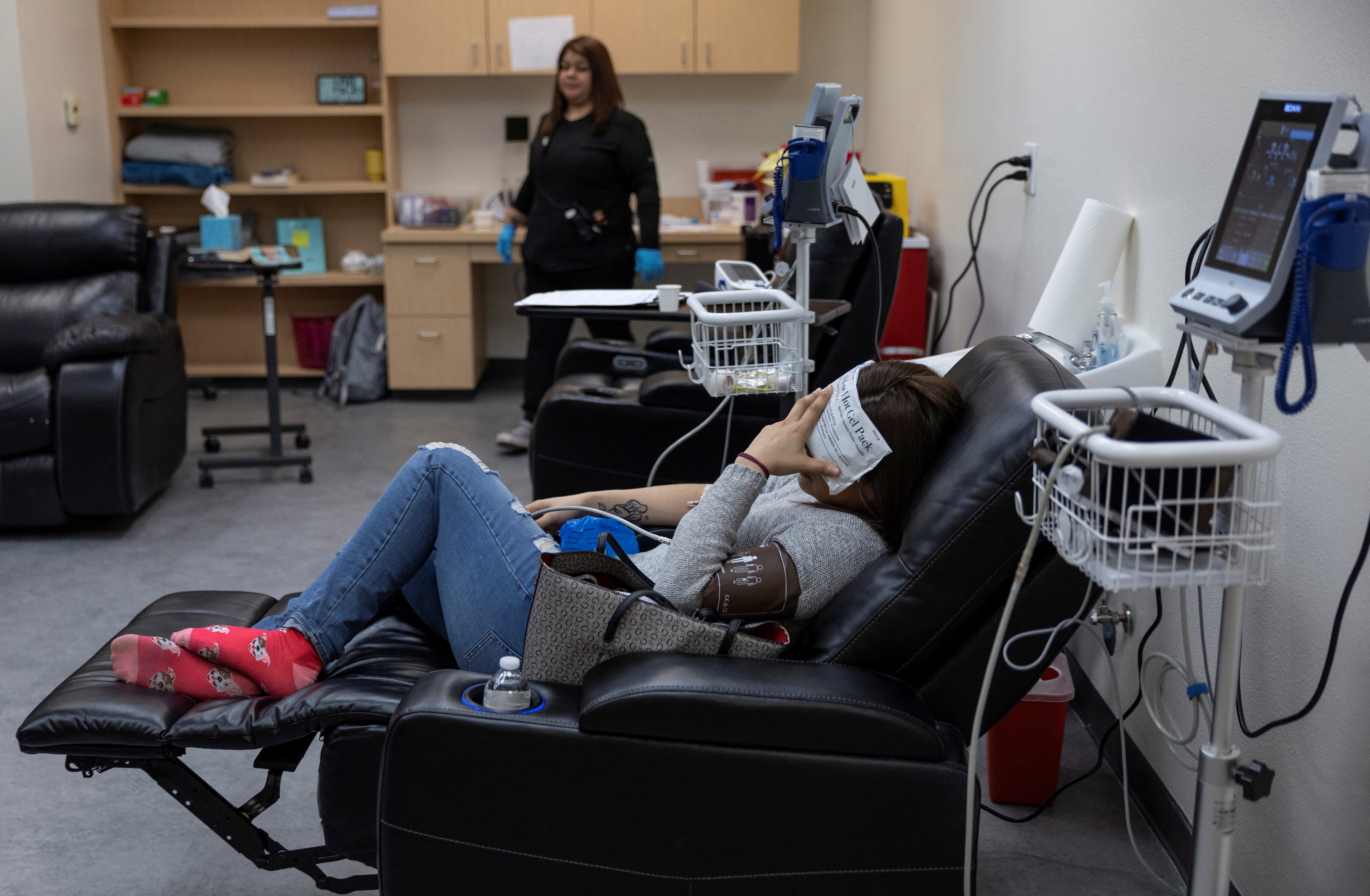 A patient lies in the recovery room following a surgical abortion at Alamo Women's Clinic in Albuquerque, New Mexico