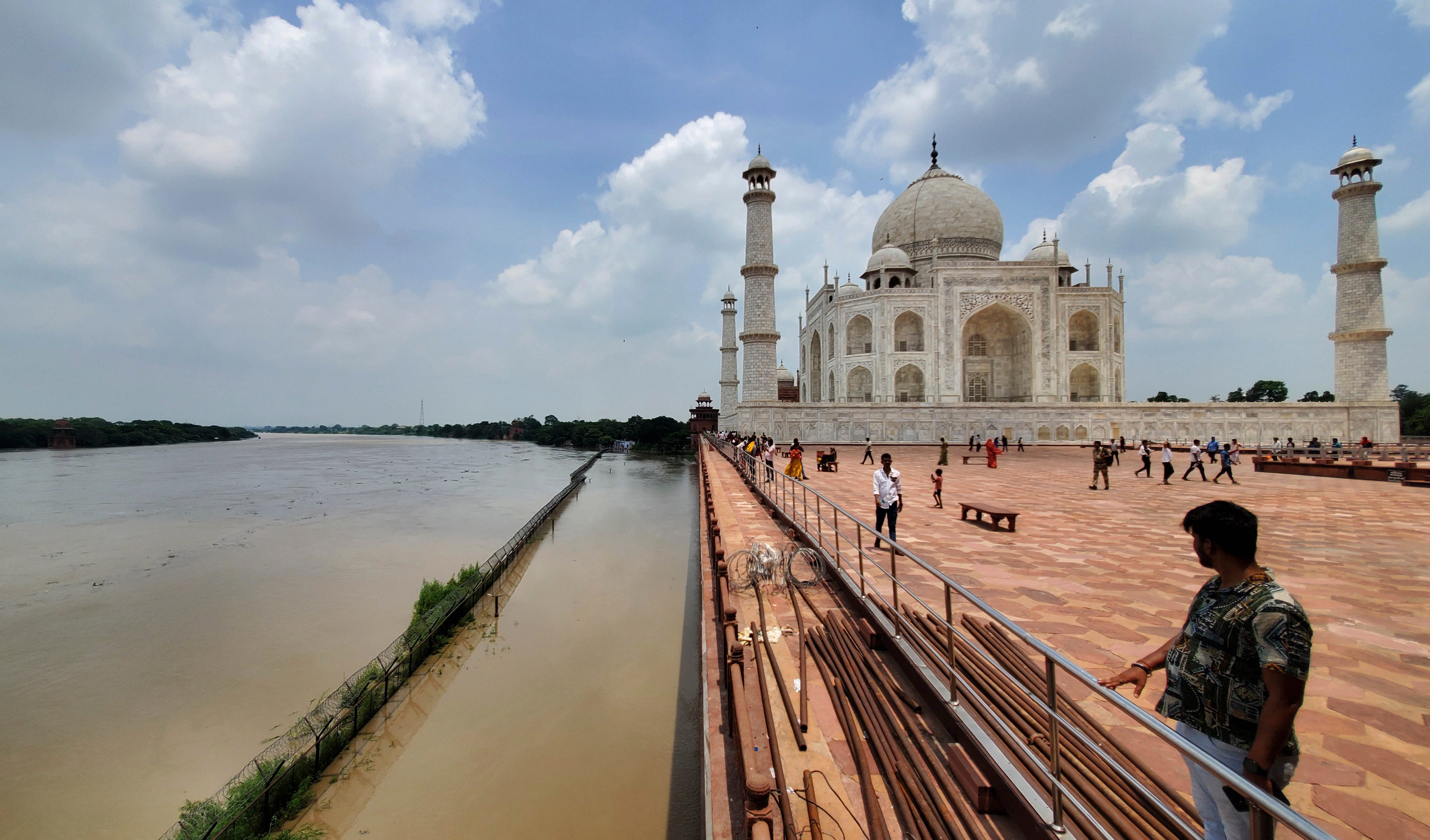 A swollen Yamuna river rises to the periphery of the Taj Mahal