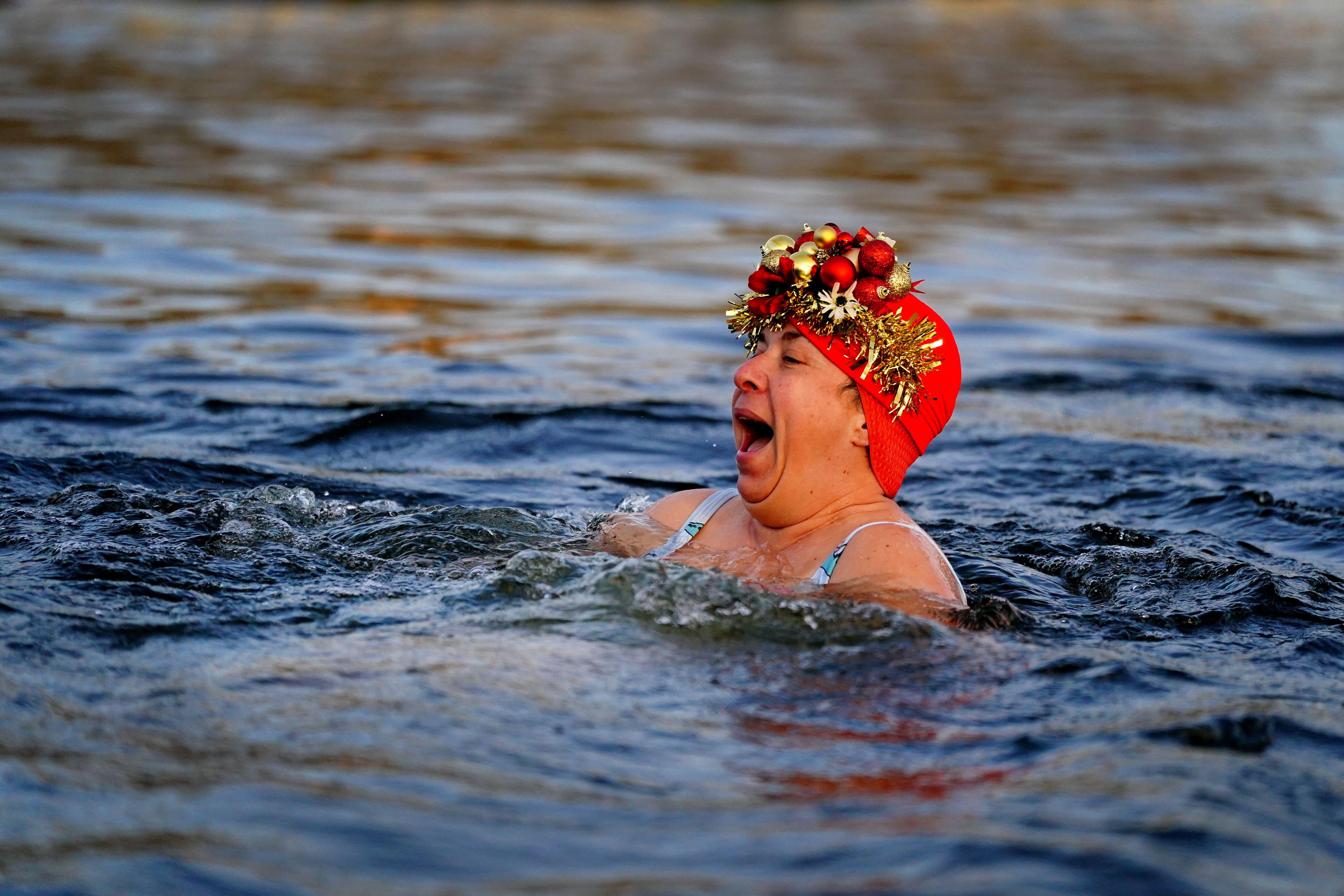 Being active in nature, such as swimming outdoors, helps to improve mental and physical health and could save the NHS millions (Victoria Jones/PA)