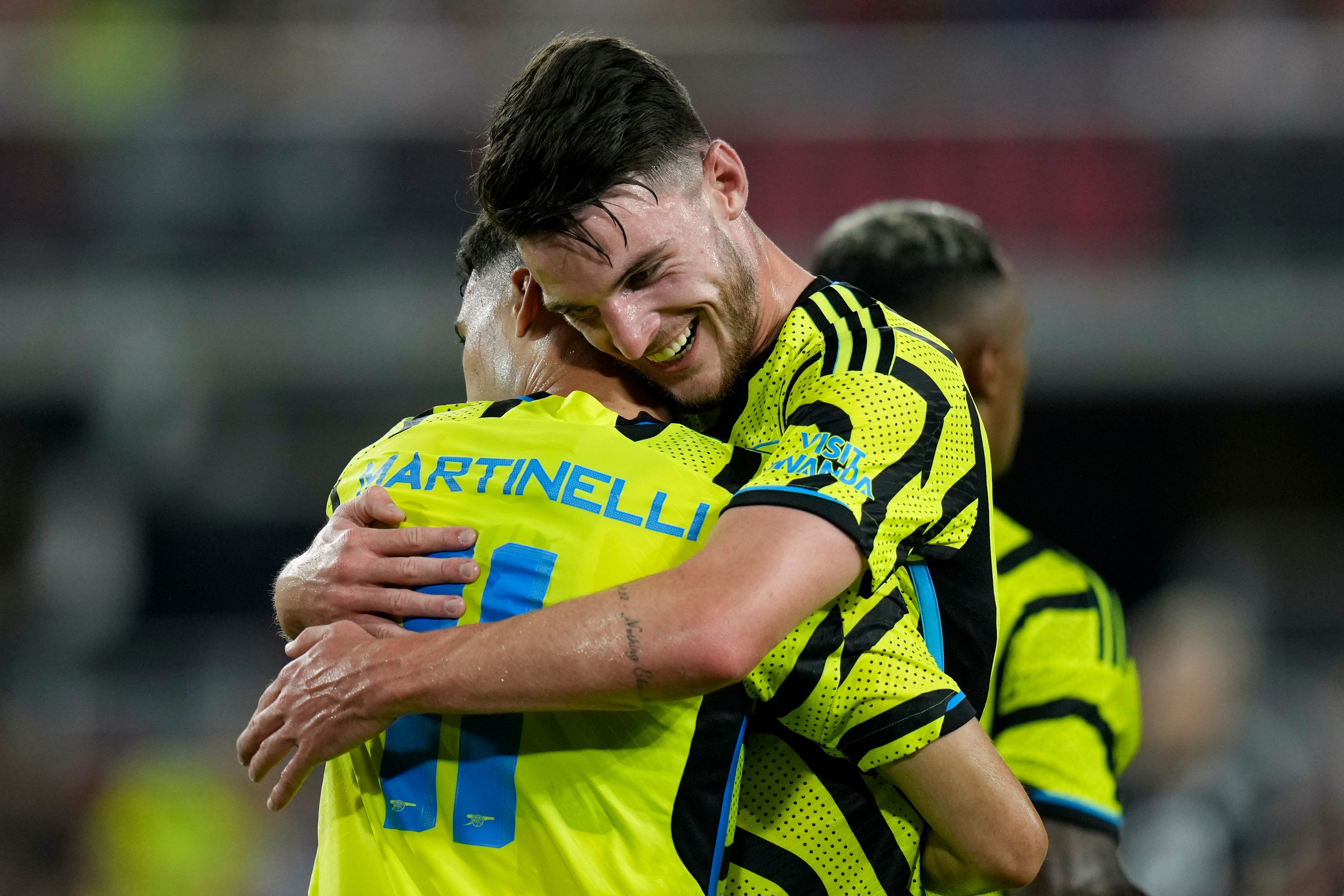 Arsenal midfielder Declan Rice, right, hugs team-mate Gabriel Martinelli (Alex Brandon/AP)