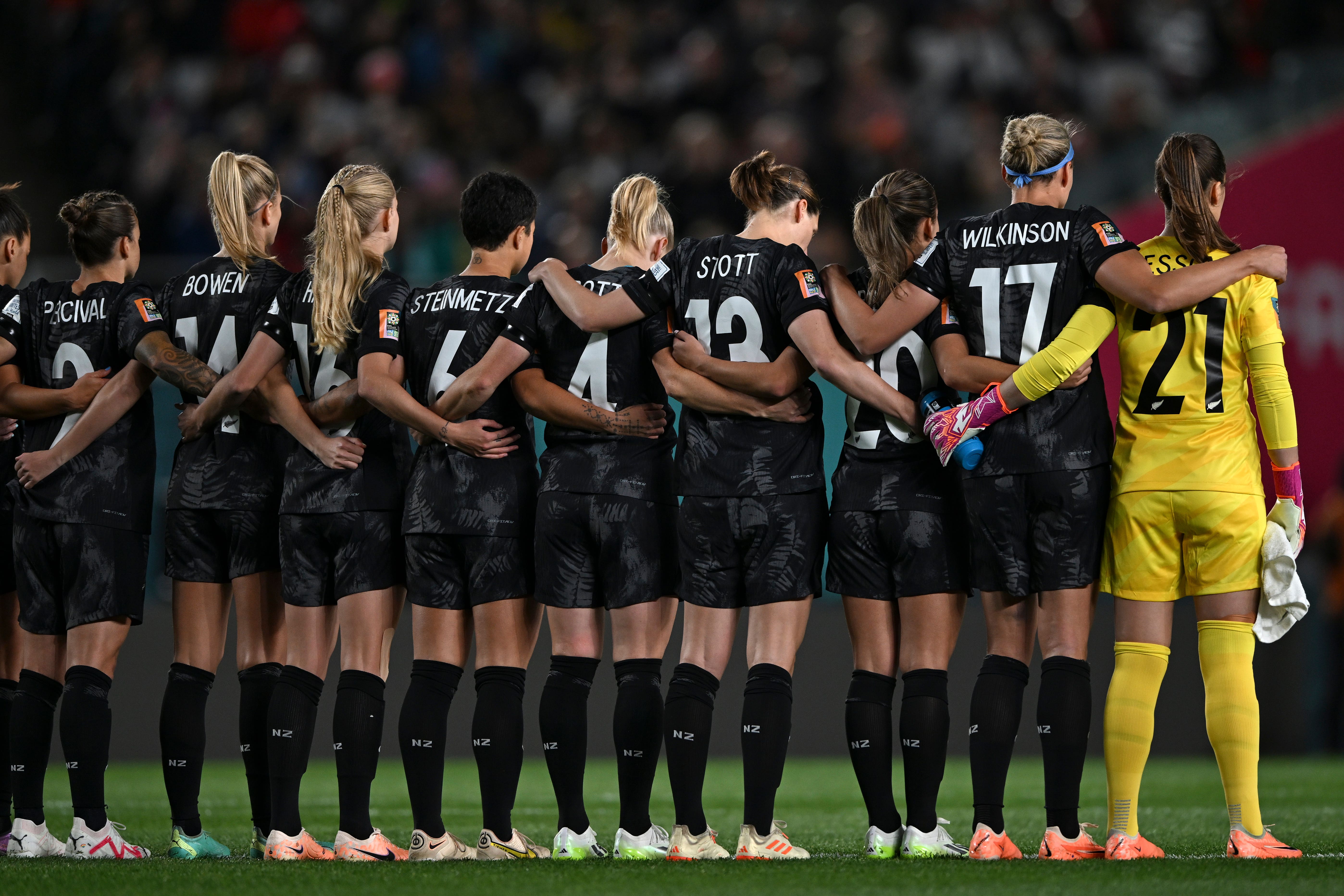 New Zealand players observe a moment of silence for the victims of a shooting attack in Auckland (Andrew Cornaga/AP)