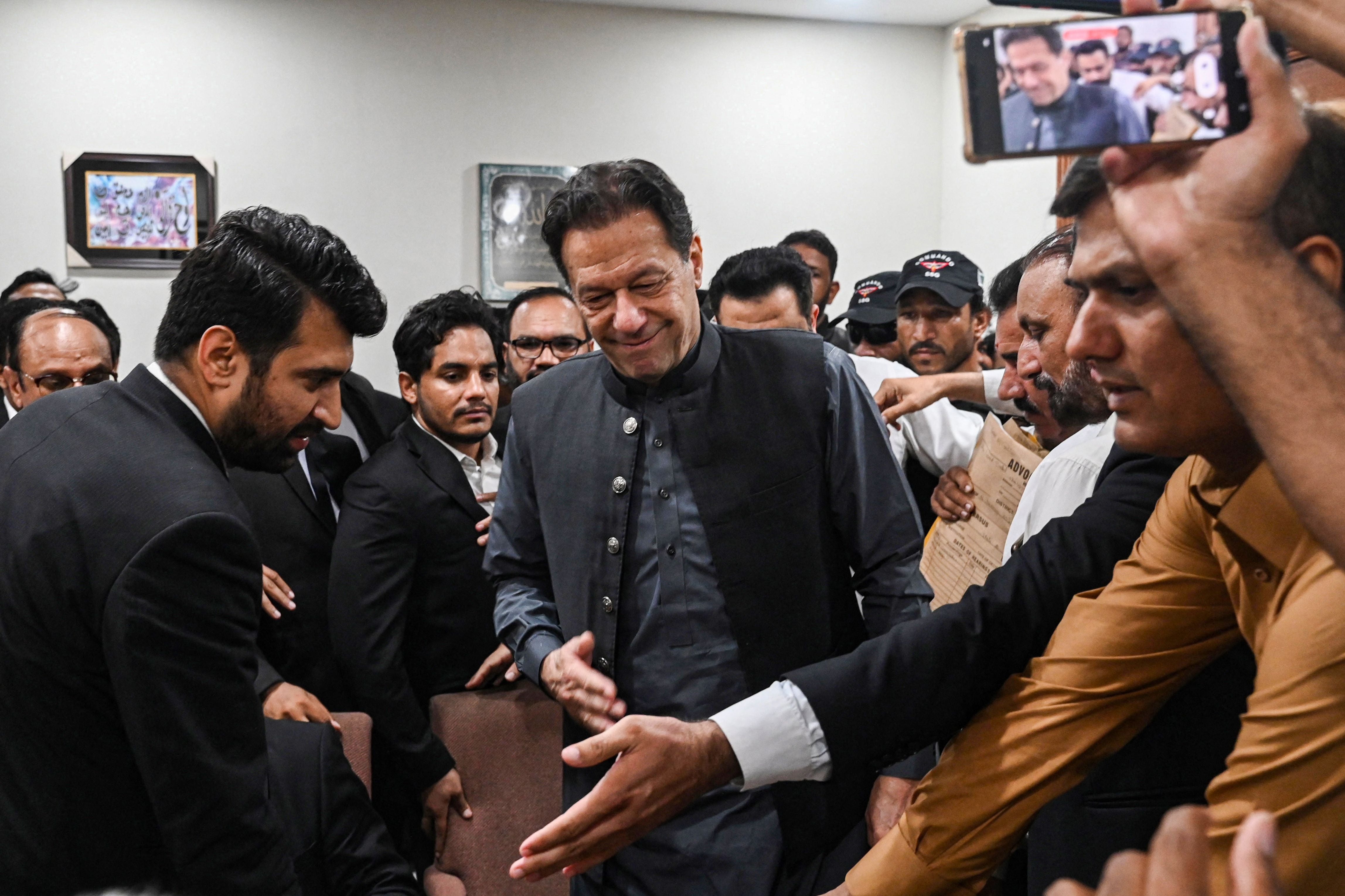 Pakistan’s former prime minister, Imran Khan arrives at a registrar office in Lahore High court to sign surety bonds for bail in various cases, in Lahore on 3 July