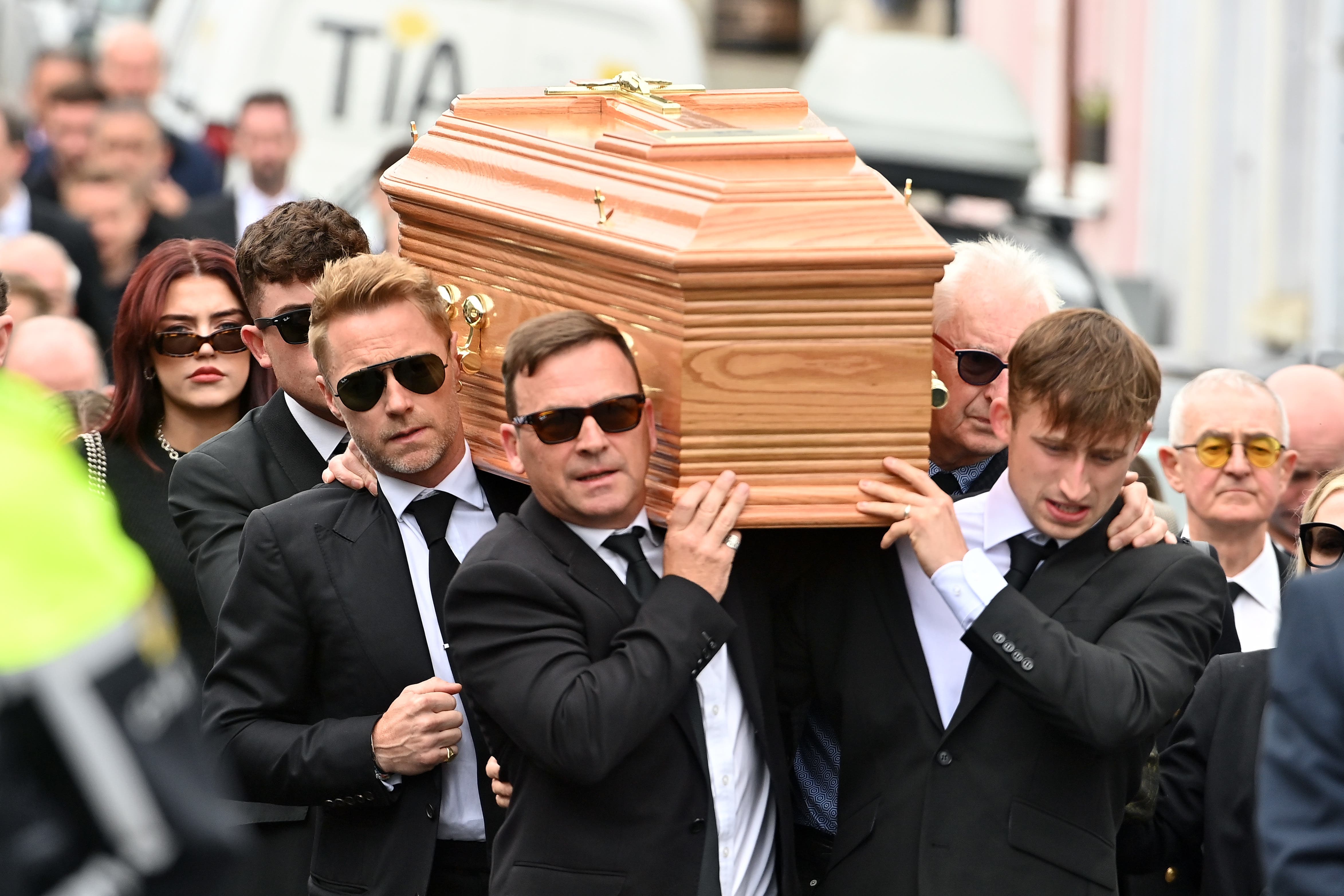 Ronan Keating (centre middle left) helps carry the coffin of his brother Ciaran Keating towards St Patrick’s Church in Louisburgh, Co Mayo, for his funeral. The older brother of Ronan Keating died in a two-car crash near Swinford in Co Mayo (Oliver McVeigh/PA)