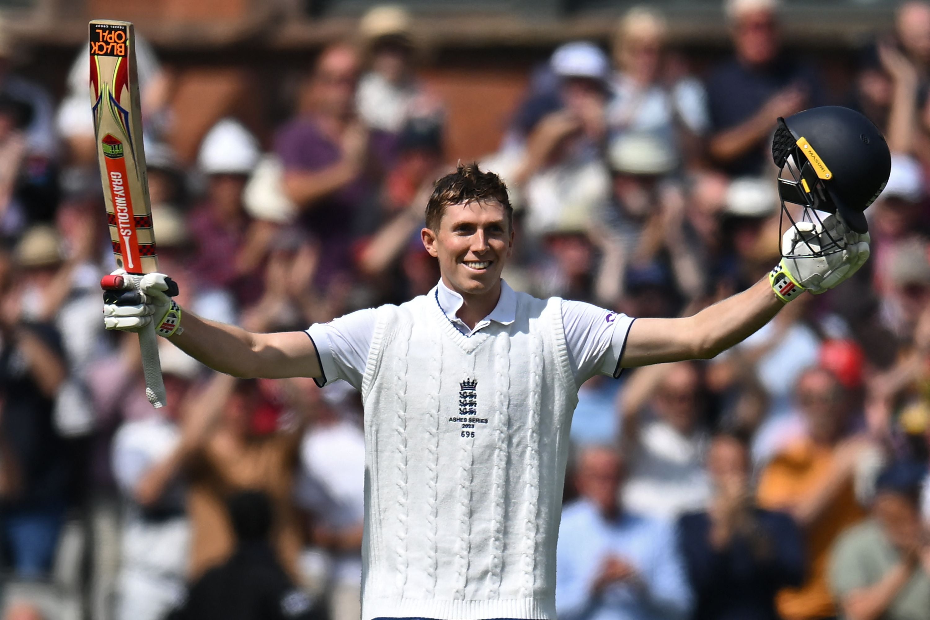 Zak Crawley celebrates after bringing up his century