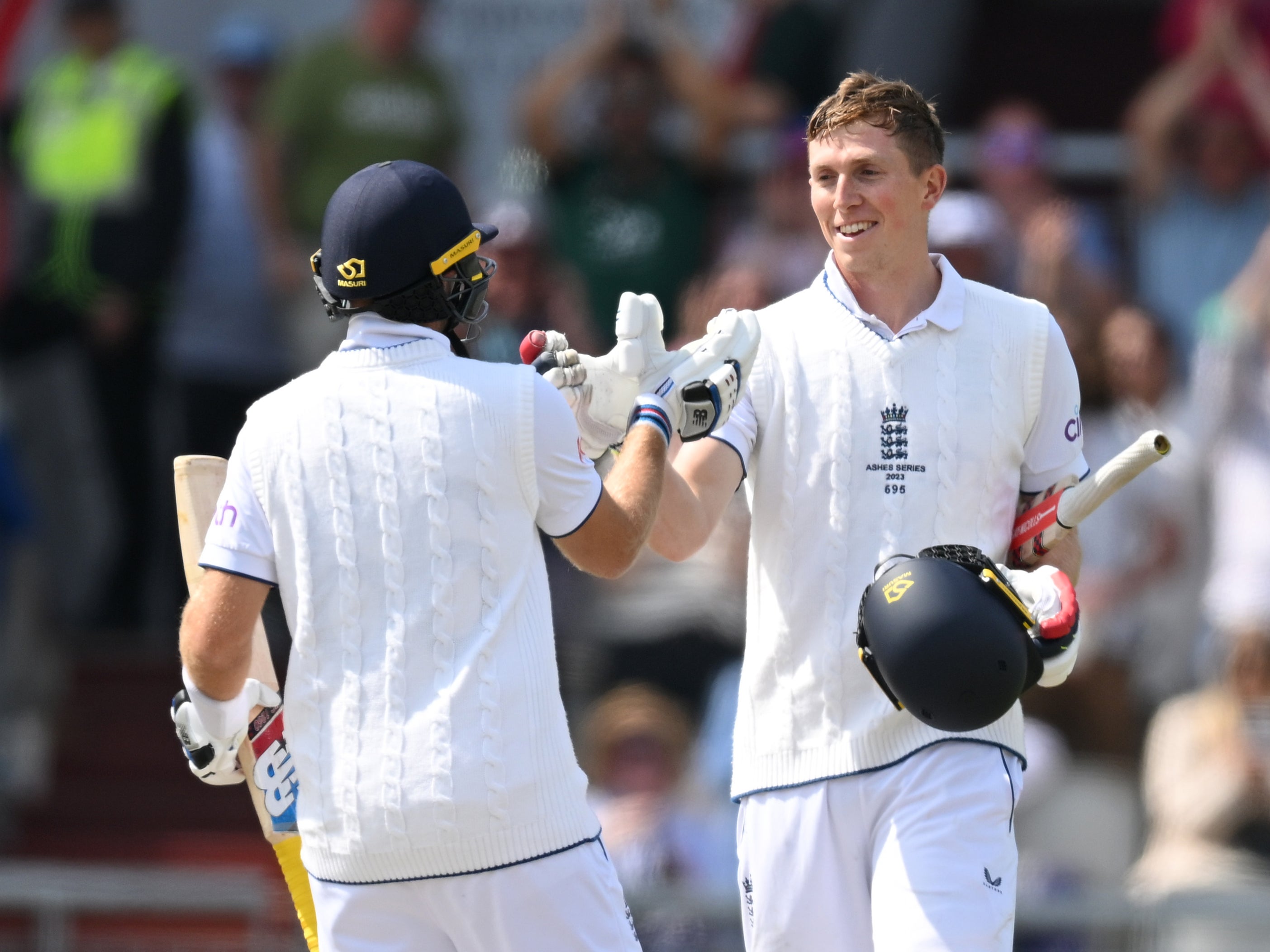 Crawley is congratulated by Joe Root