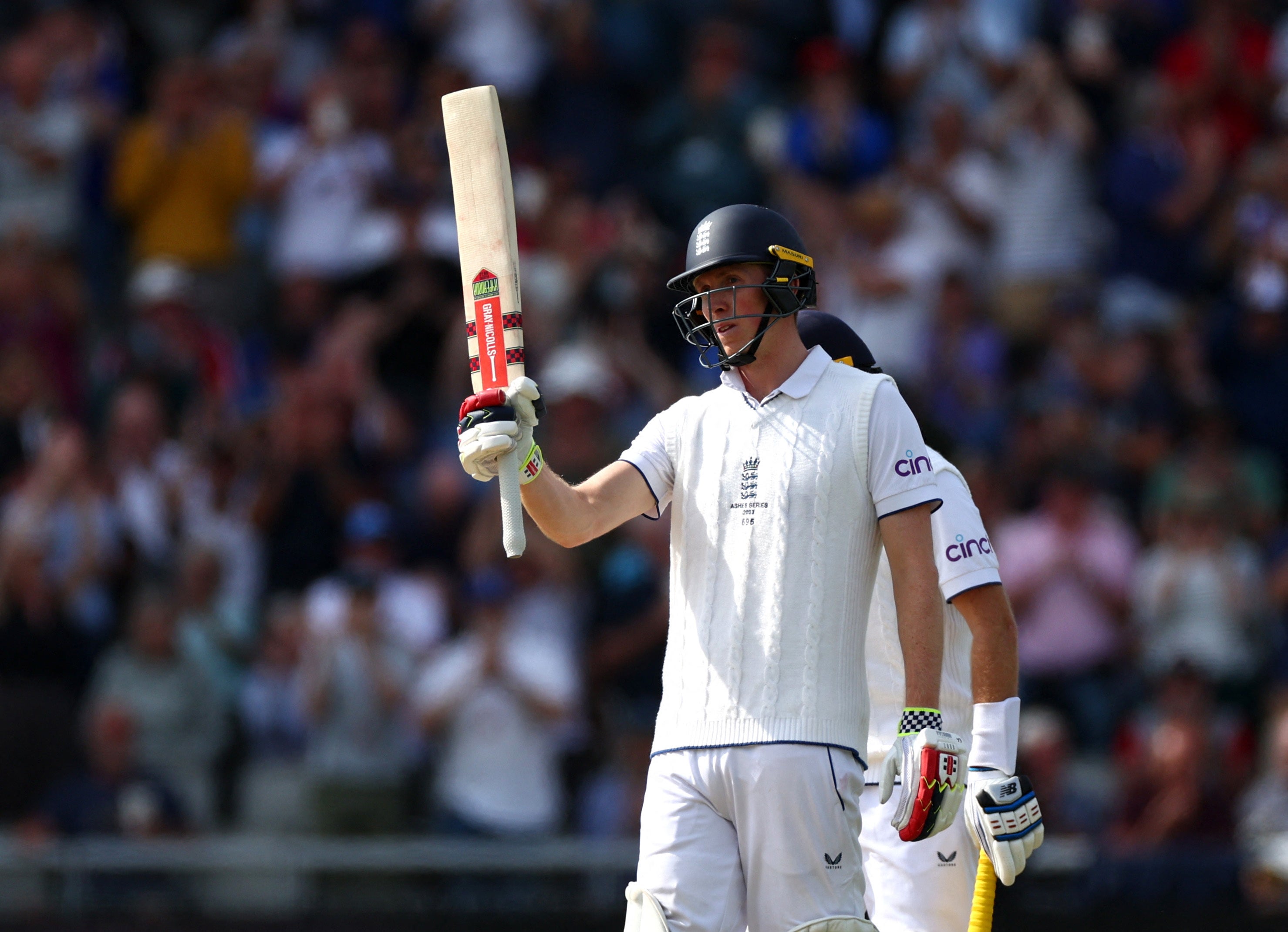 Zak Crawley salutes the England dressing room on day two