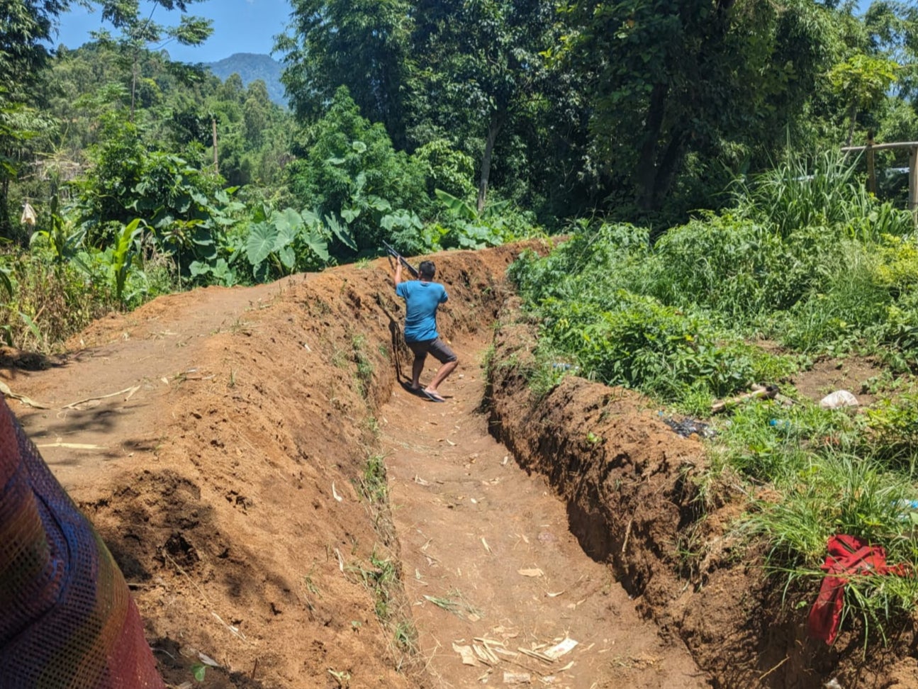 N Bobby Singh showing the training routine as he runs in the trenches from one bunker to another in Kadangband