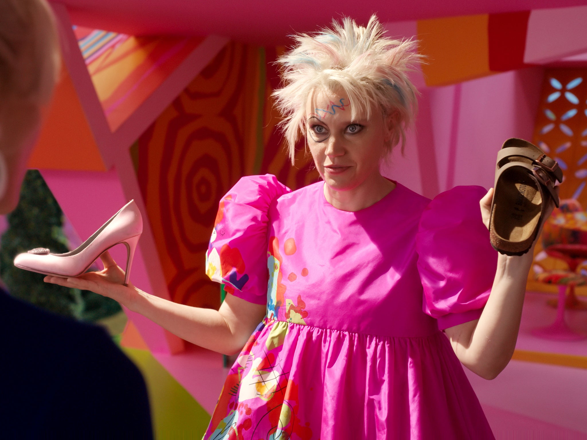 In ‘Barbie’, Kate McKinnon’s Weird Barbie lives with a collection of discontinued dolls