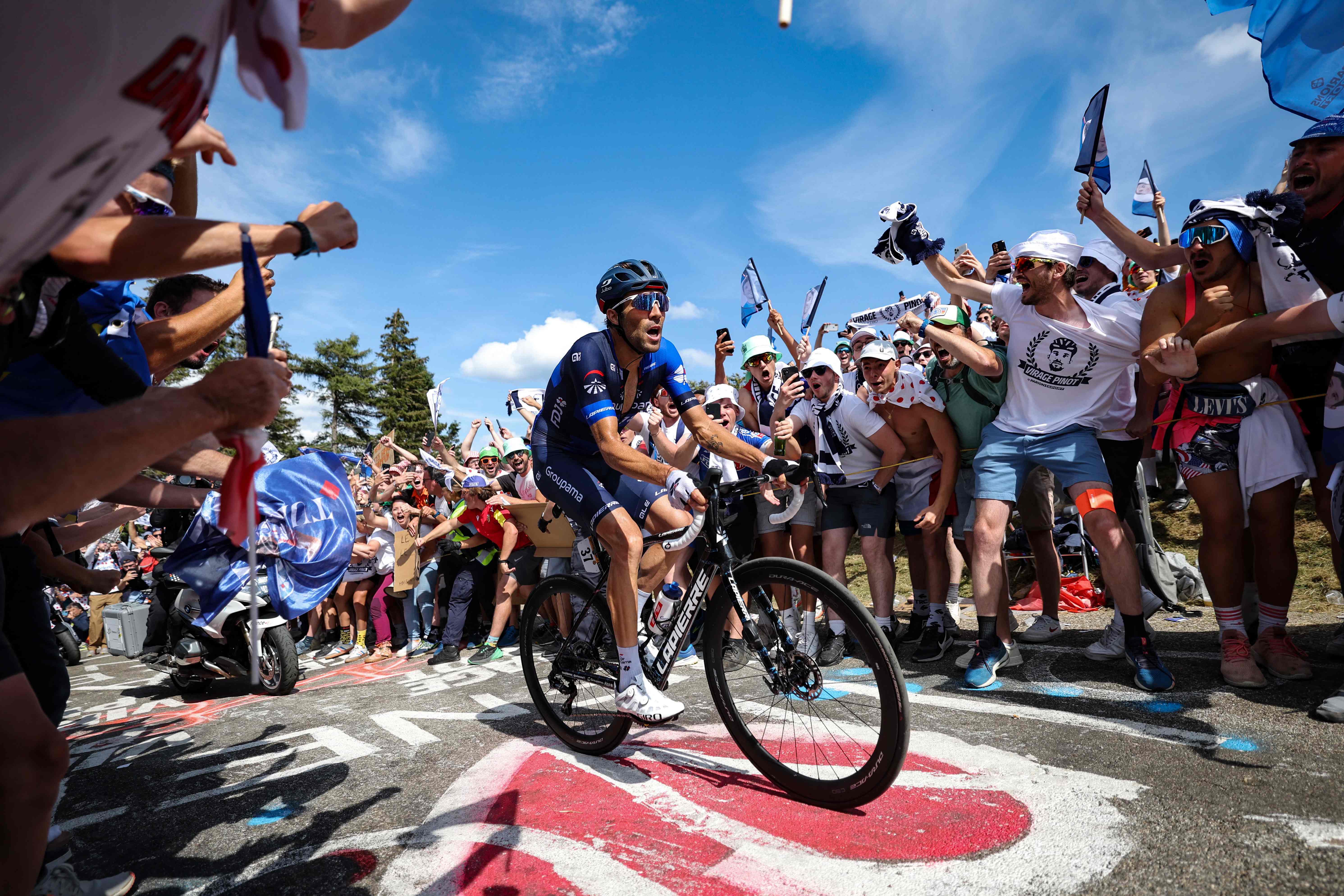 Pinot rides through the crowds on the Petit Ballon