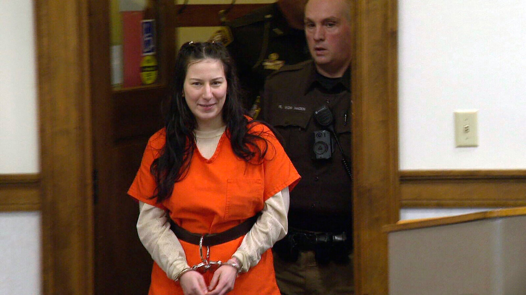 Taylor Schabusiness returns to a Brown County courtroom after attacking her attorney Quinn Jolly, during a hearing in Green Bay, Wis., Feb. 14, 2023.