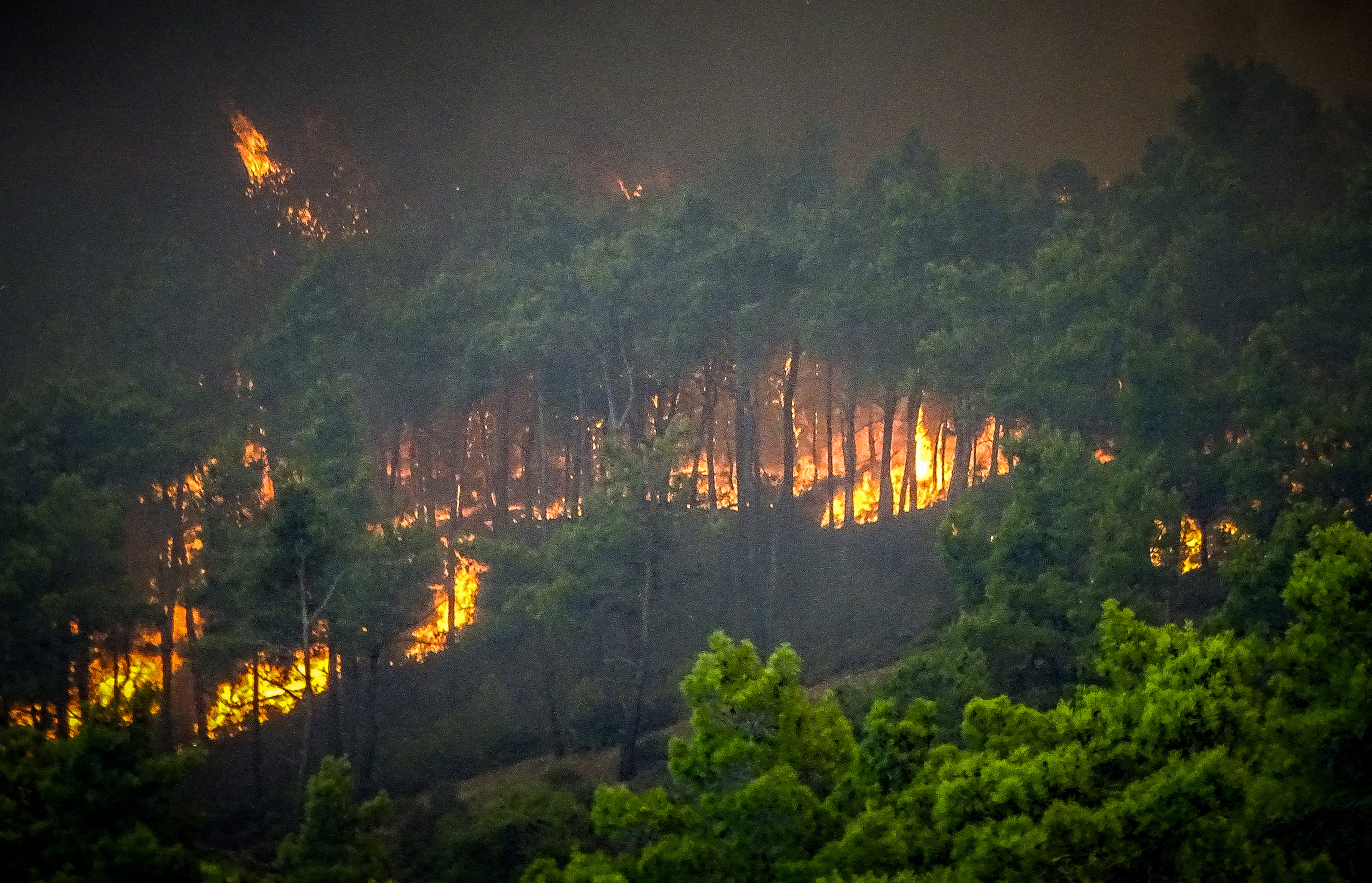 Smoke rises from a wildfire on the island of Rhodes on July 22