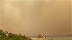 Greece: Smoke turns Rhodes sky grey and hazy as wildfires continue to rage