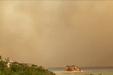 Greece: Smoke turns Rhodes sky grey and hazy as wildfires continue to rage