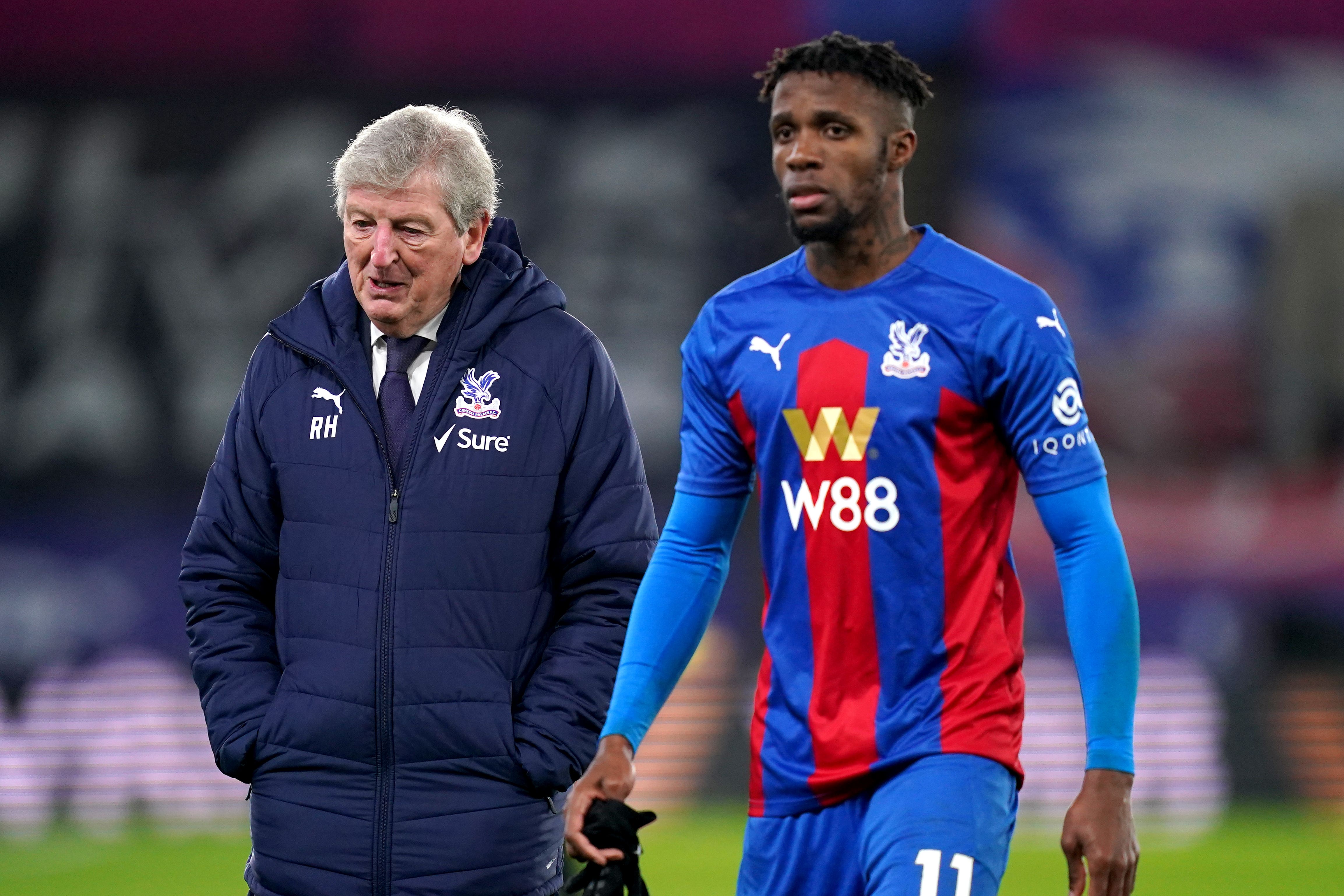 Roy Hodgson, left, paid tribute to Wilfried Zaha (John Walton/PA)