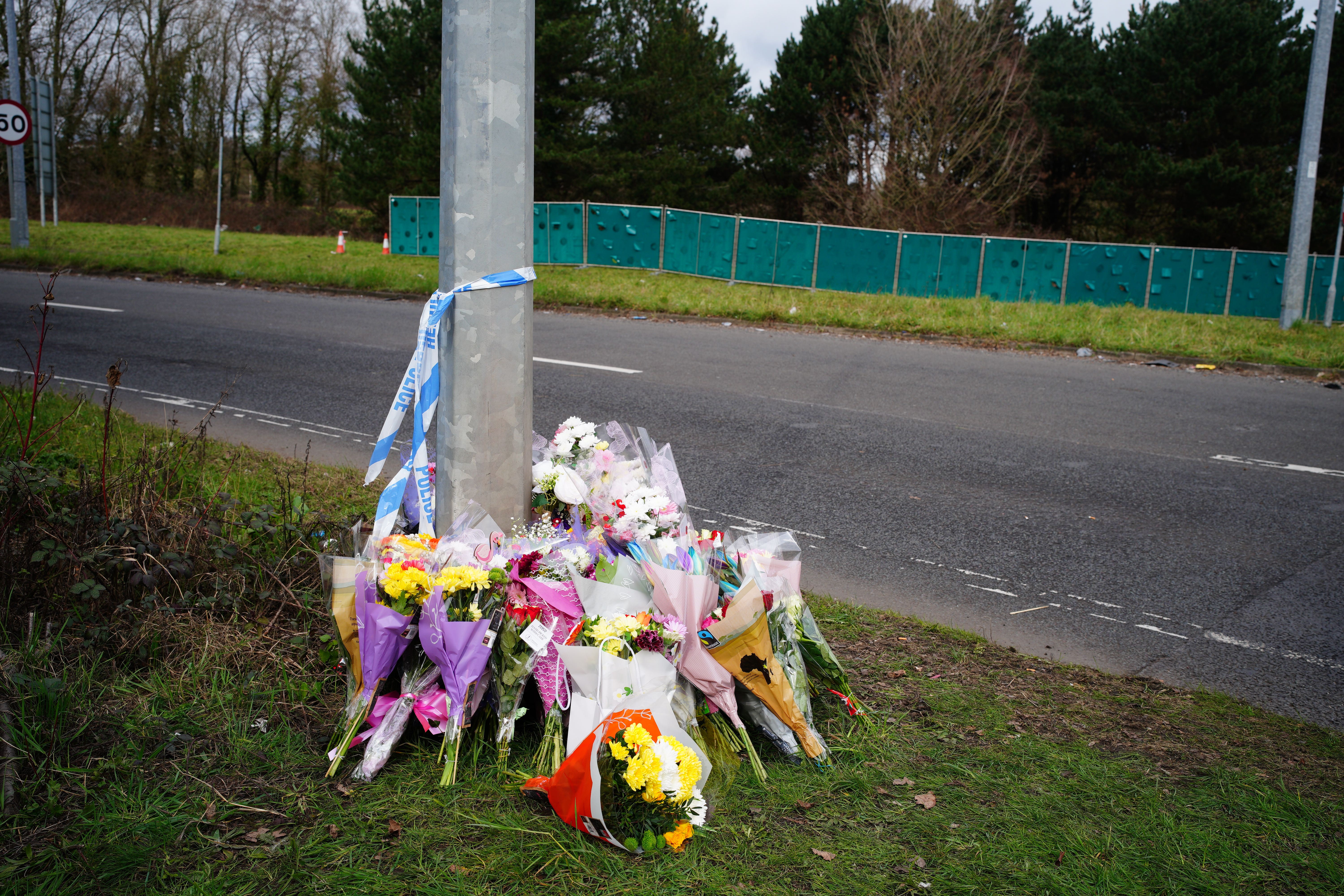 Floral tributes left near the scene in the St Mellons area of Cardiff