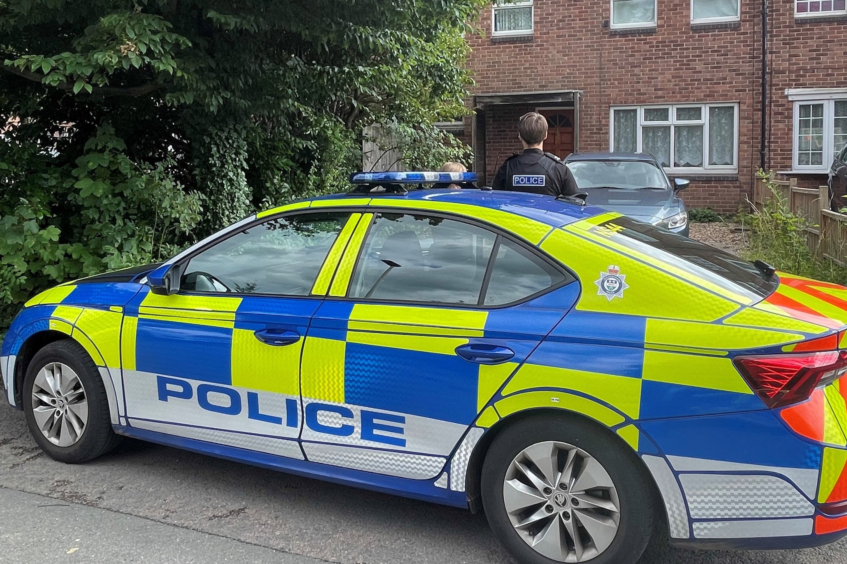 Police outside a property in Hopyard Close, Leicester, after a five-year-old boy and a man aged 41 were found dead (Matthew Cooper/PA)