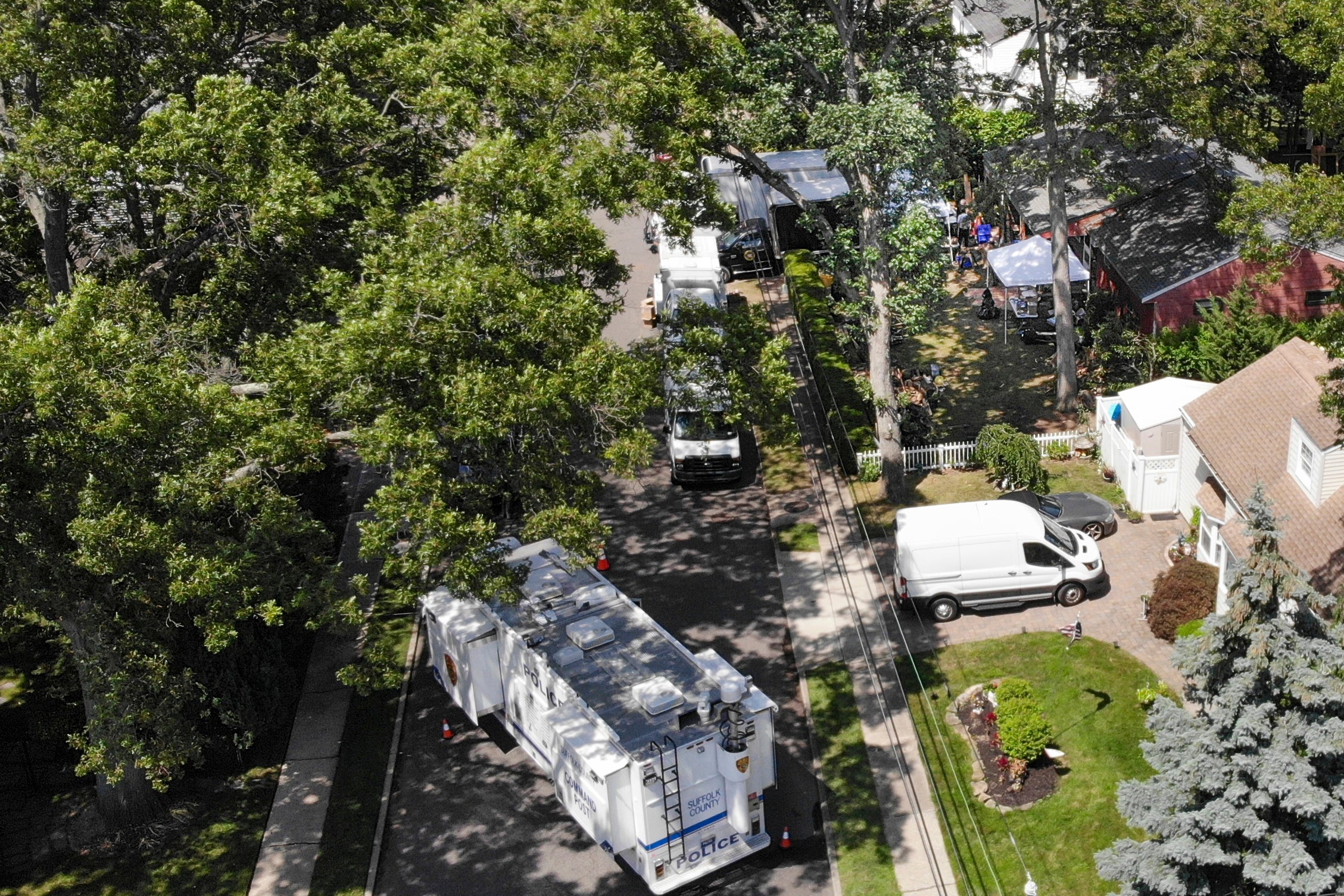 Authorities searching the home of suspect Rex Heuerman