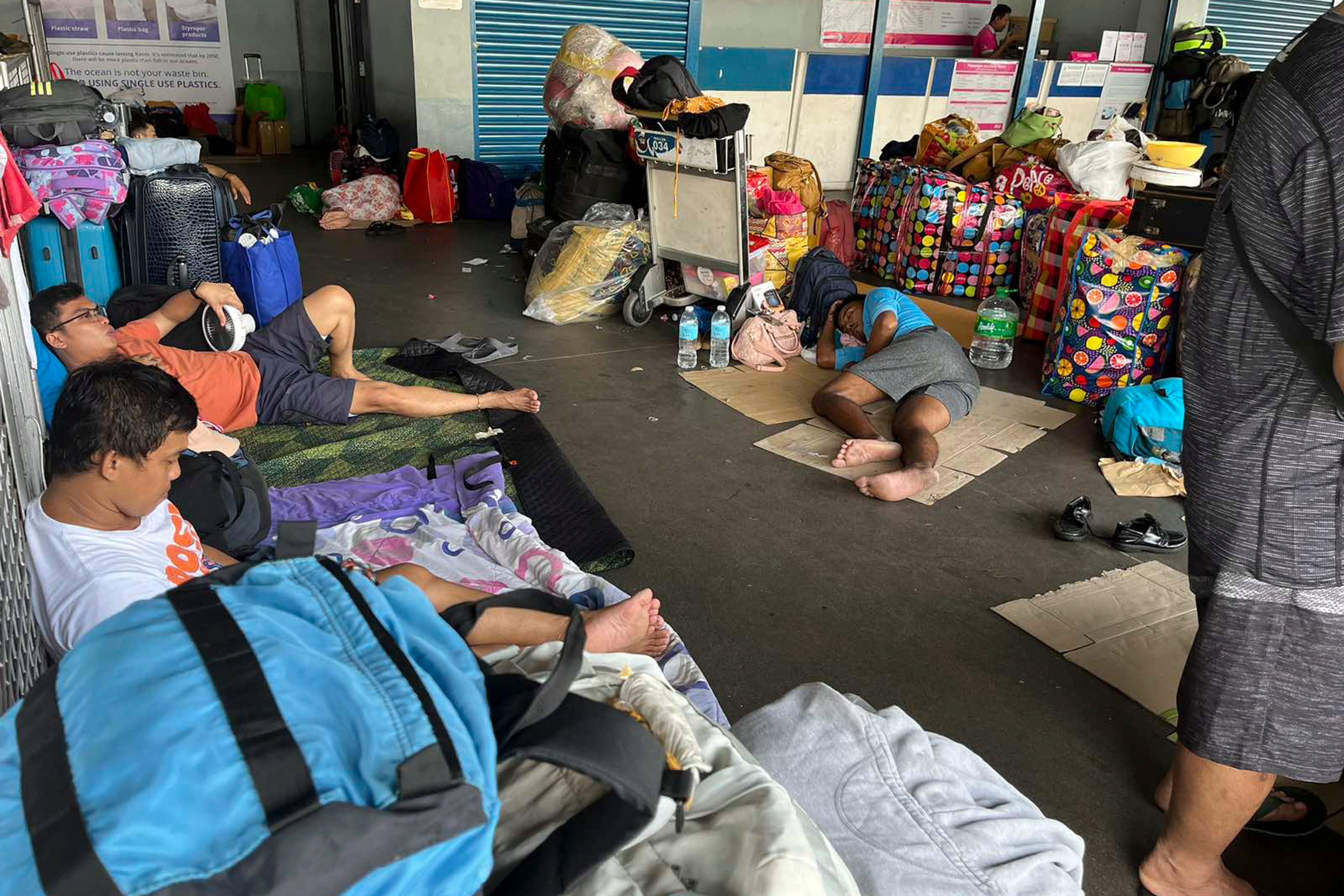 Typhoon blows off roofs, floods villages and displaces thousands in northern Philippines