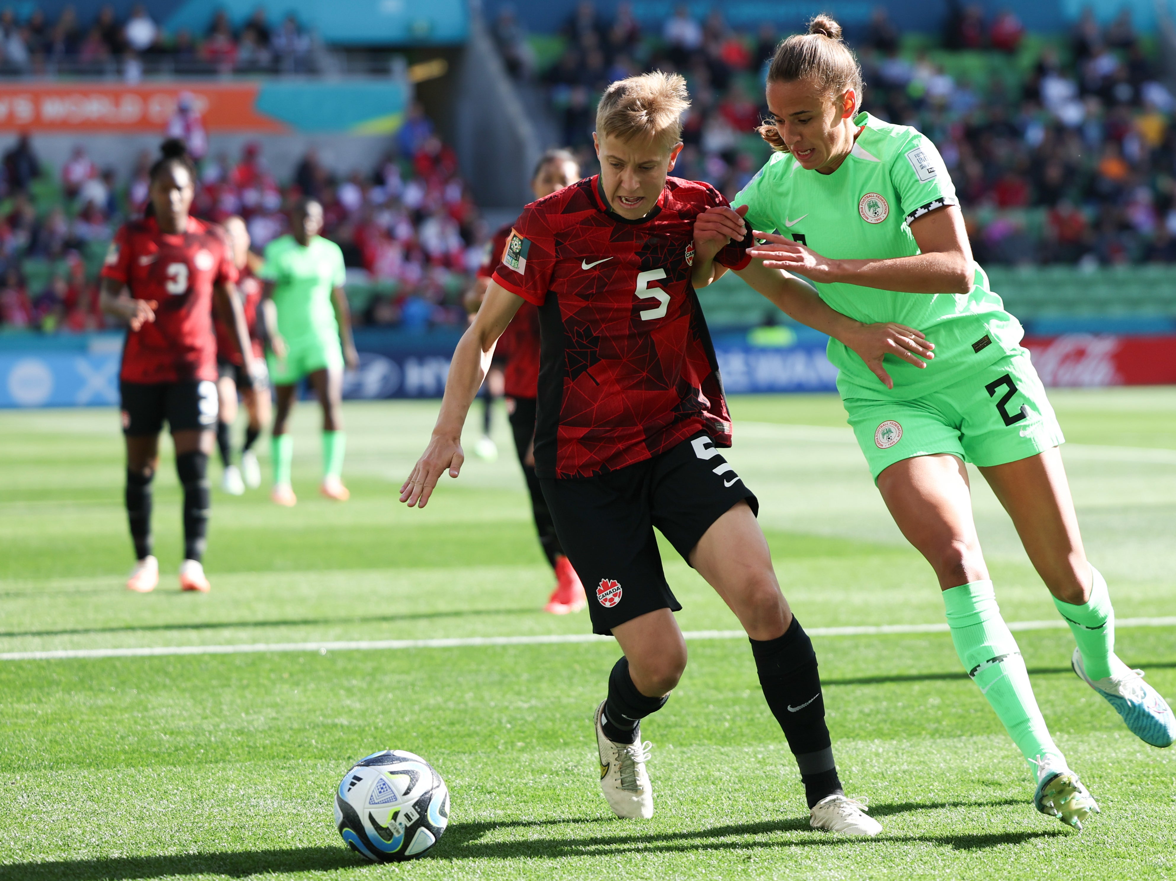 Canada’s Quinn and Nigeria’s Ashleigh Plumptre battle for the ball during the Women’s World Cup opening Group B match in Melbourne, Australia, on Friday 21 July 2023