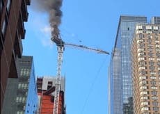 New York City construction crane catches fire and partially collapses on top of Manhattan high-rise