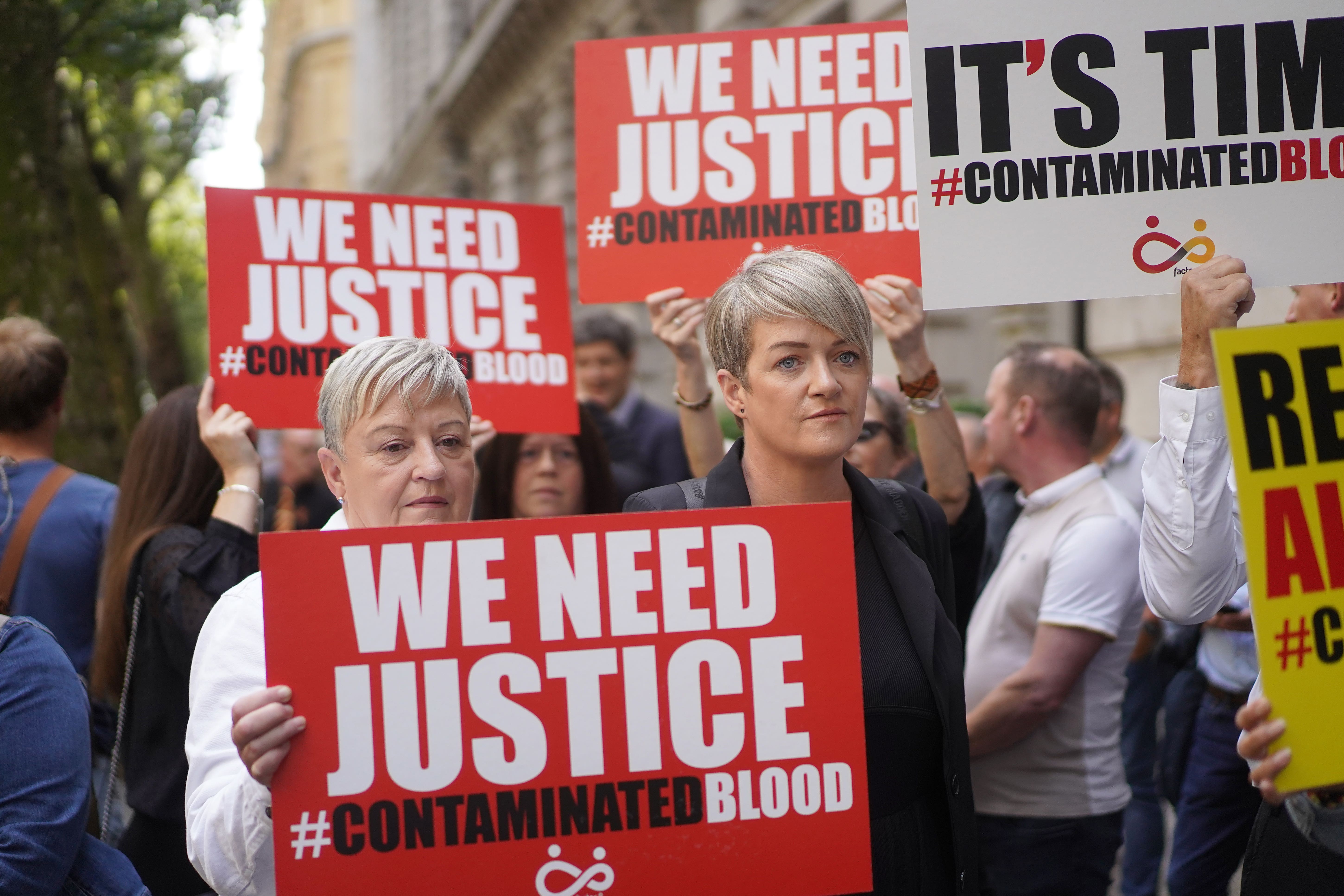 Campaigners gather in Westminster, London, calling for compensation for victims to be authorised by Rishi Sunak (Victoria Jones/PA)