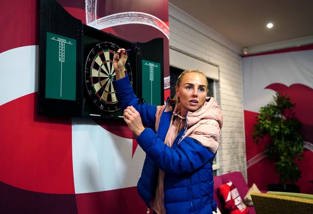 <p>England’s Alex Greenwood in action on the darts board</p>