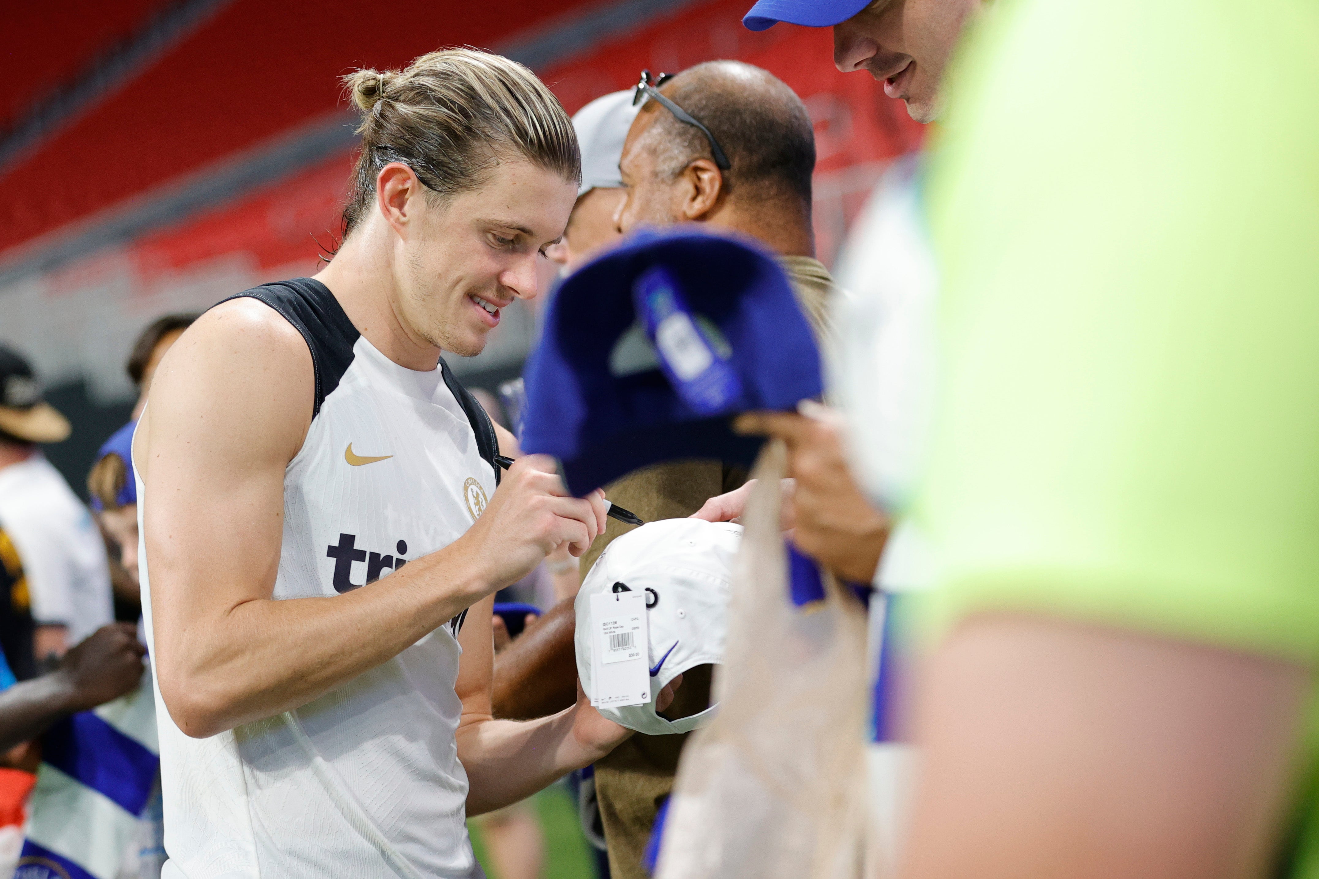 Conor Gallagher of Chelsea signs autographs for fans