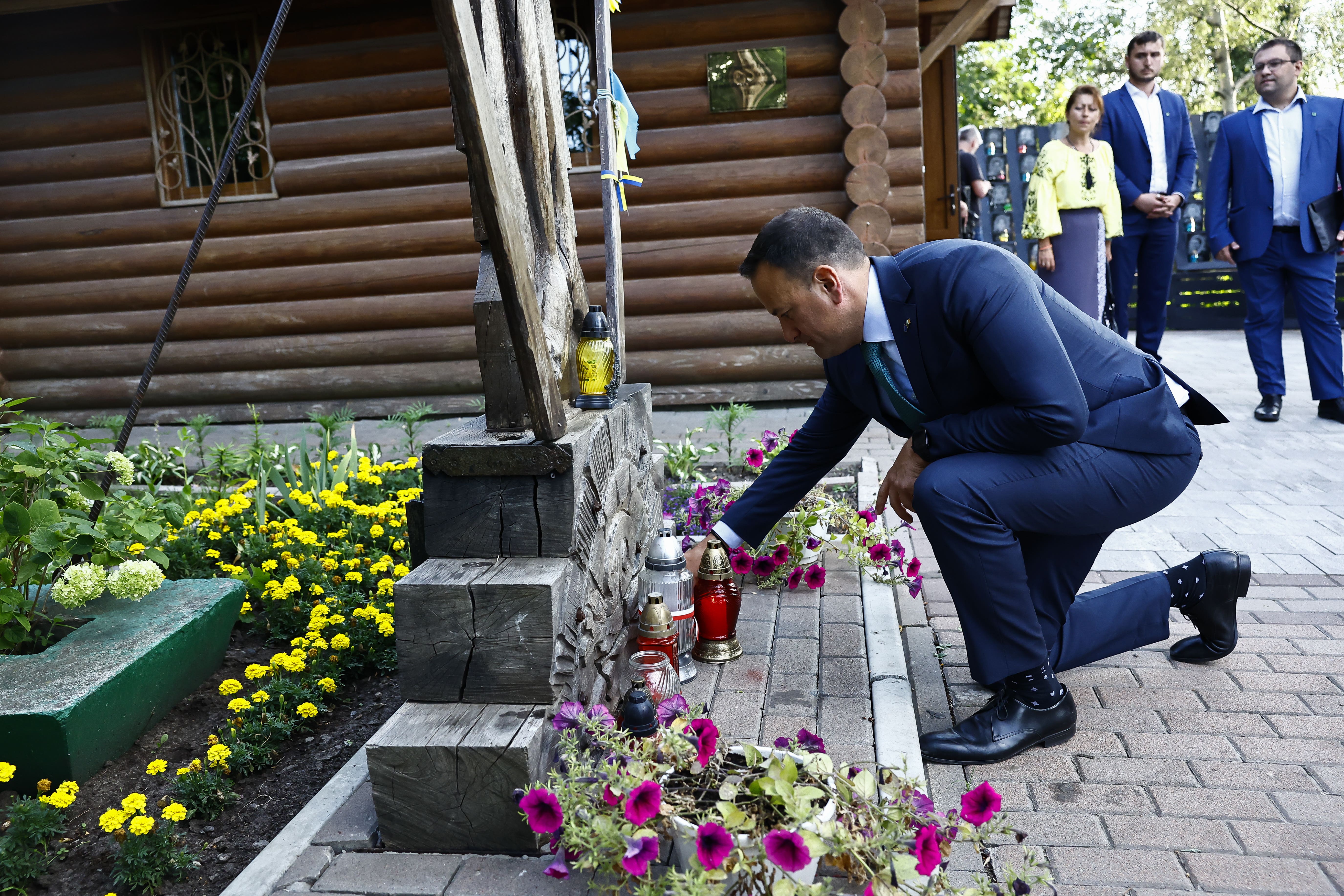 Taoiseach Leo Varadkar lights a candle during a visit to the memorial to the Heavenly Hundred at Maidan Square, Kyiv (PA/Clodagh Kilcoyne)