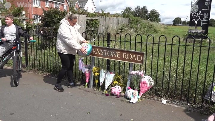 Flowers, balloons and teddy bears have been left at the site of the crash