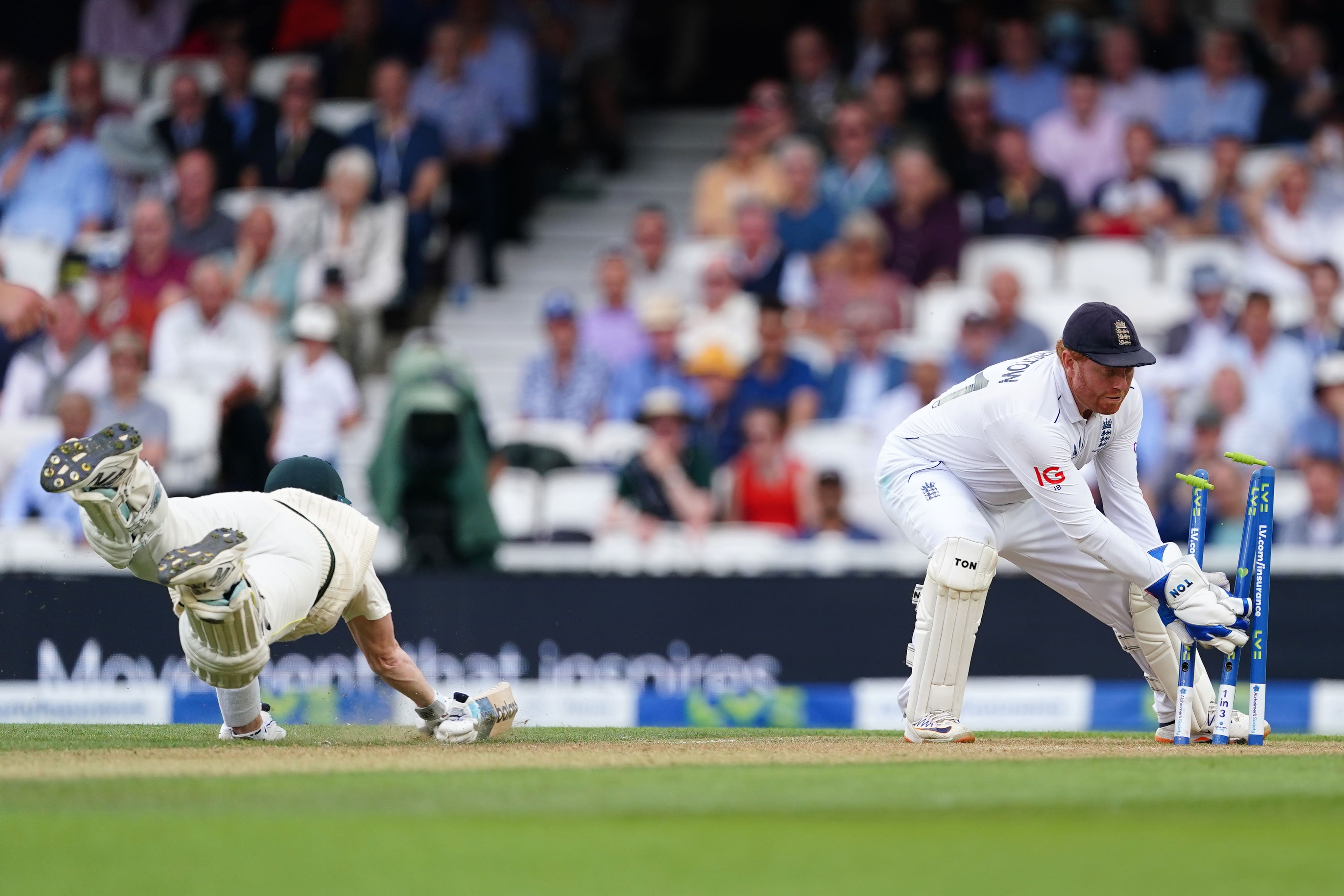 Steve Smith dives to make his ground after fine fielding by England substitute George Ealham during the 78th over of Australia’s innings (Mike Egerton/PA)