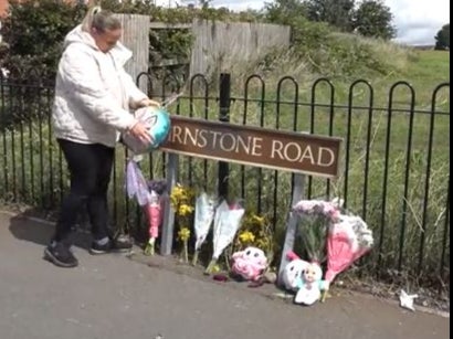 People left flowers and toys at the scene of the crash