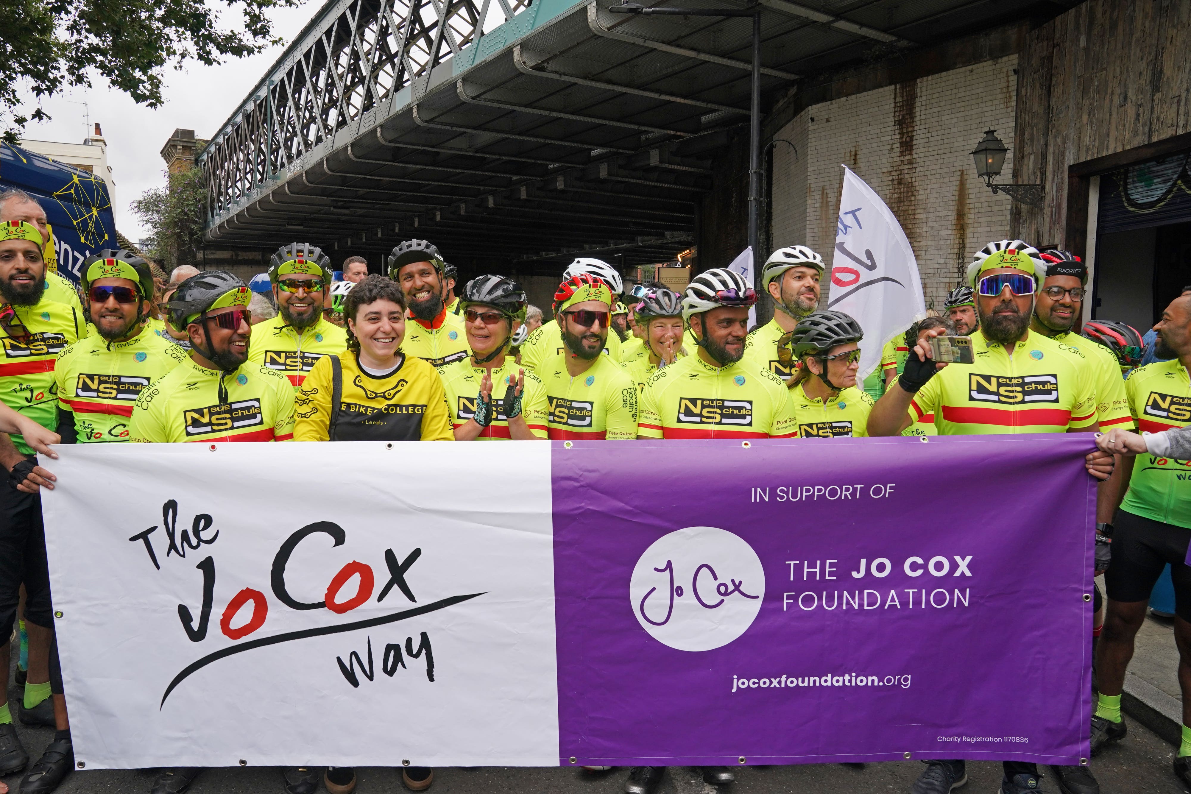 Around 80 cyclists crossed a finish line in London after a 288-mile bike ride in Jo Cox’s memory (Lucy North/PA)