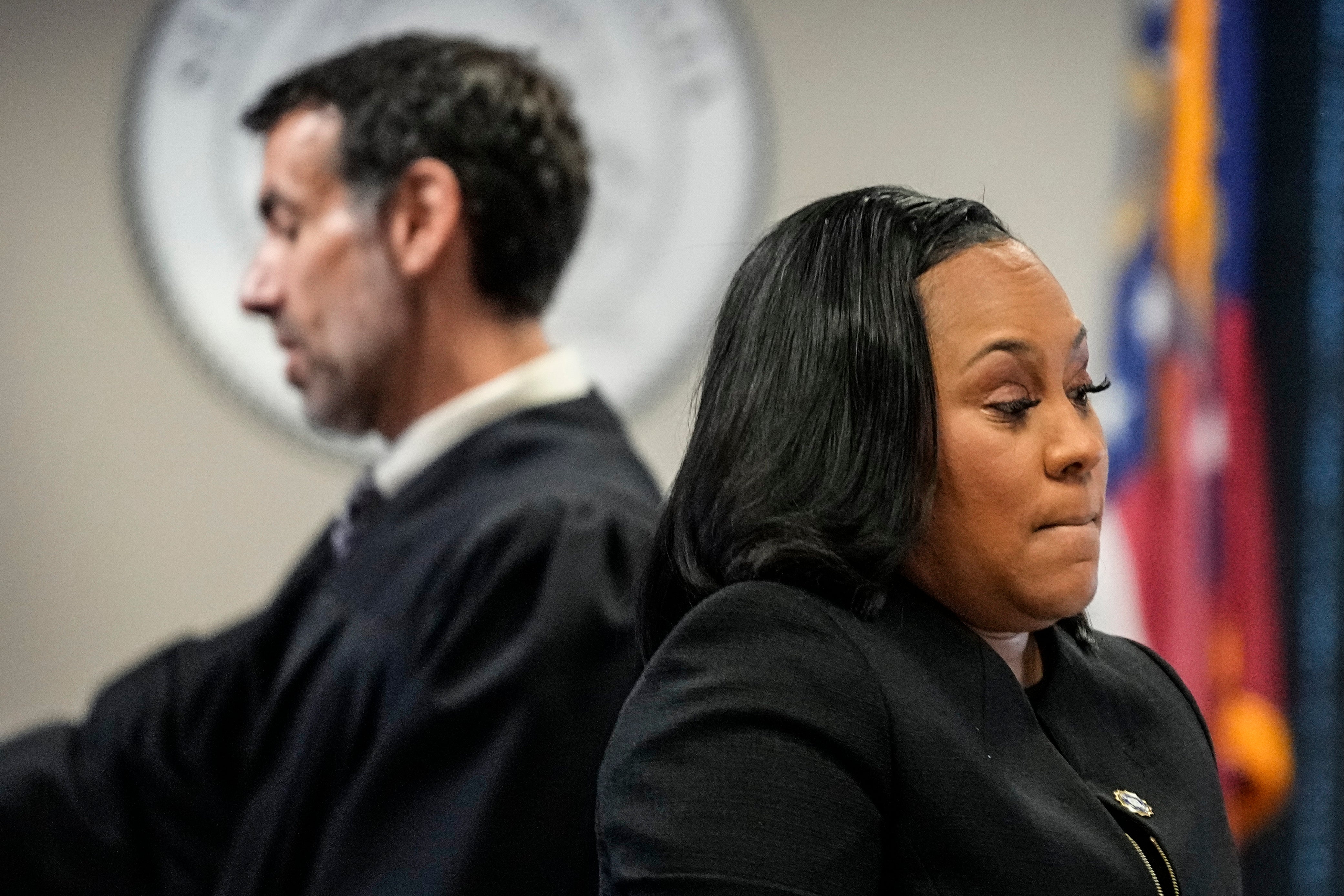 Fulton County District Attorney Fani Willis, right, and Fulton County Superior Court Judge Robert McBurney speak in court in July