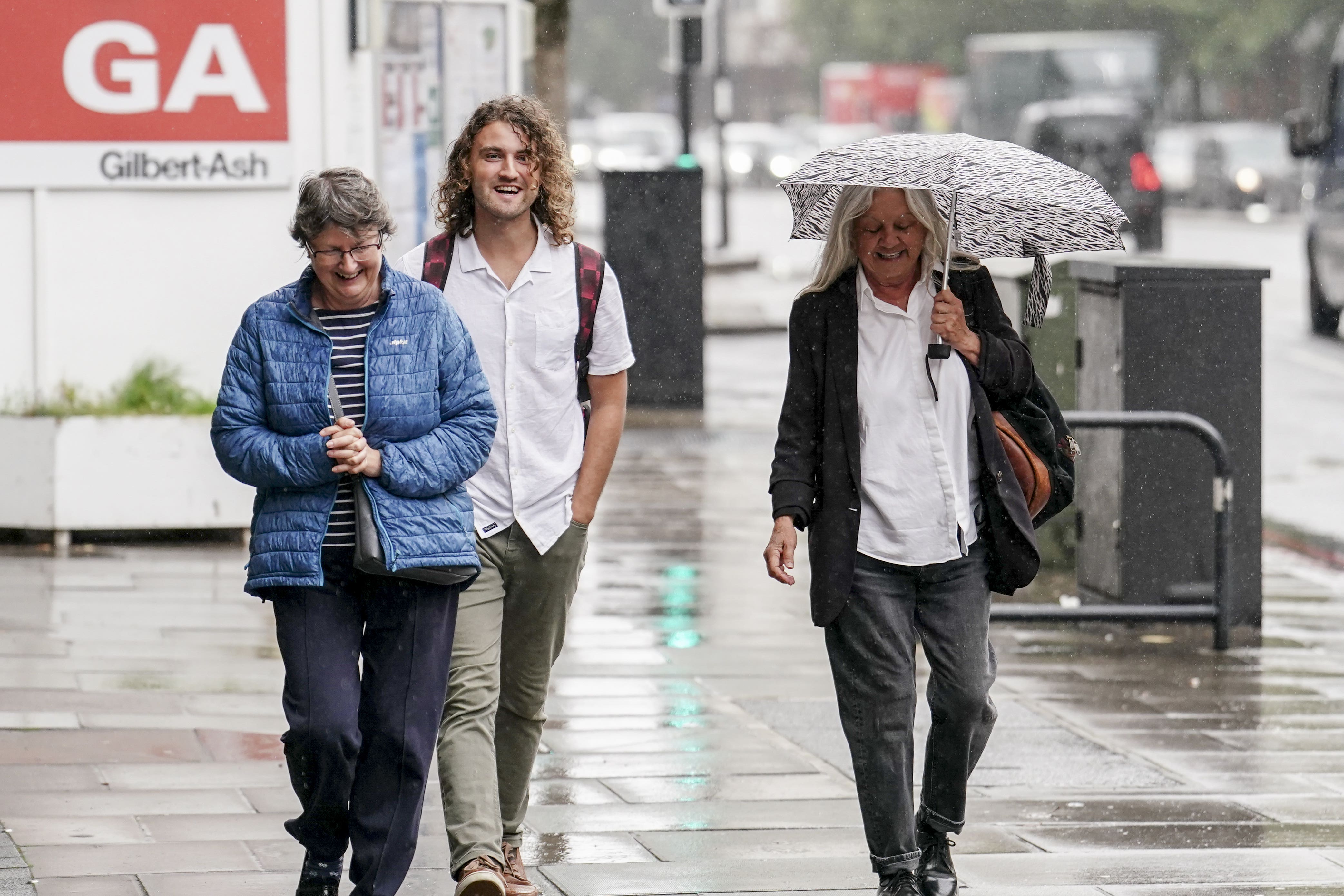 Just Stop Oil protesters Jacob Bourne, centre, and Judit Murray, right (PA)