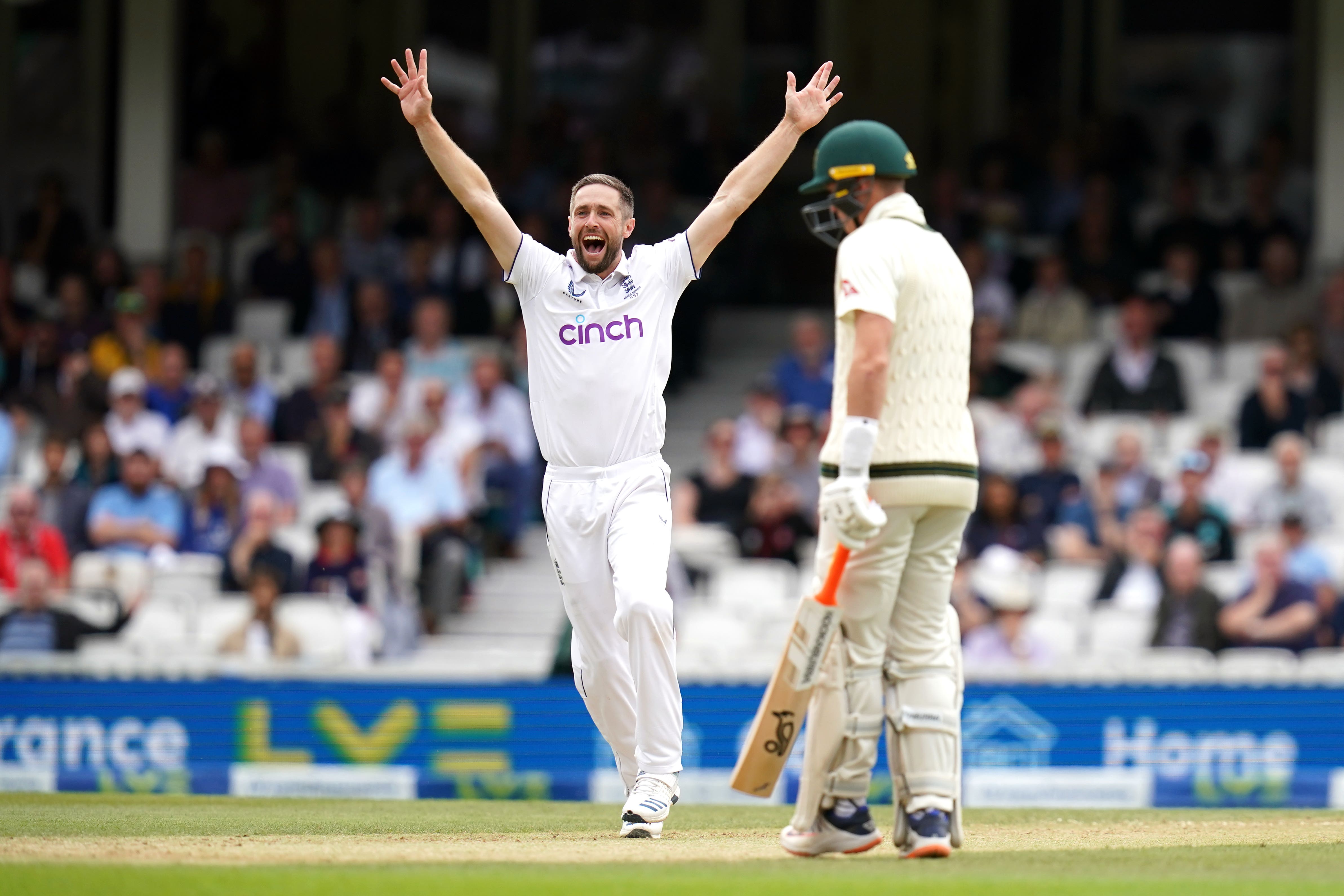 Chris Woakes (left) celebrates the wicket of Australia’s Usman Khawaja (John Walton/PA)