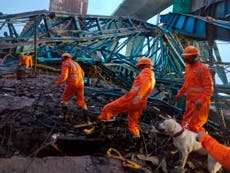 14 workers killed in the collapse of a crane being used to build a bridge in India