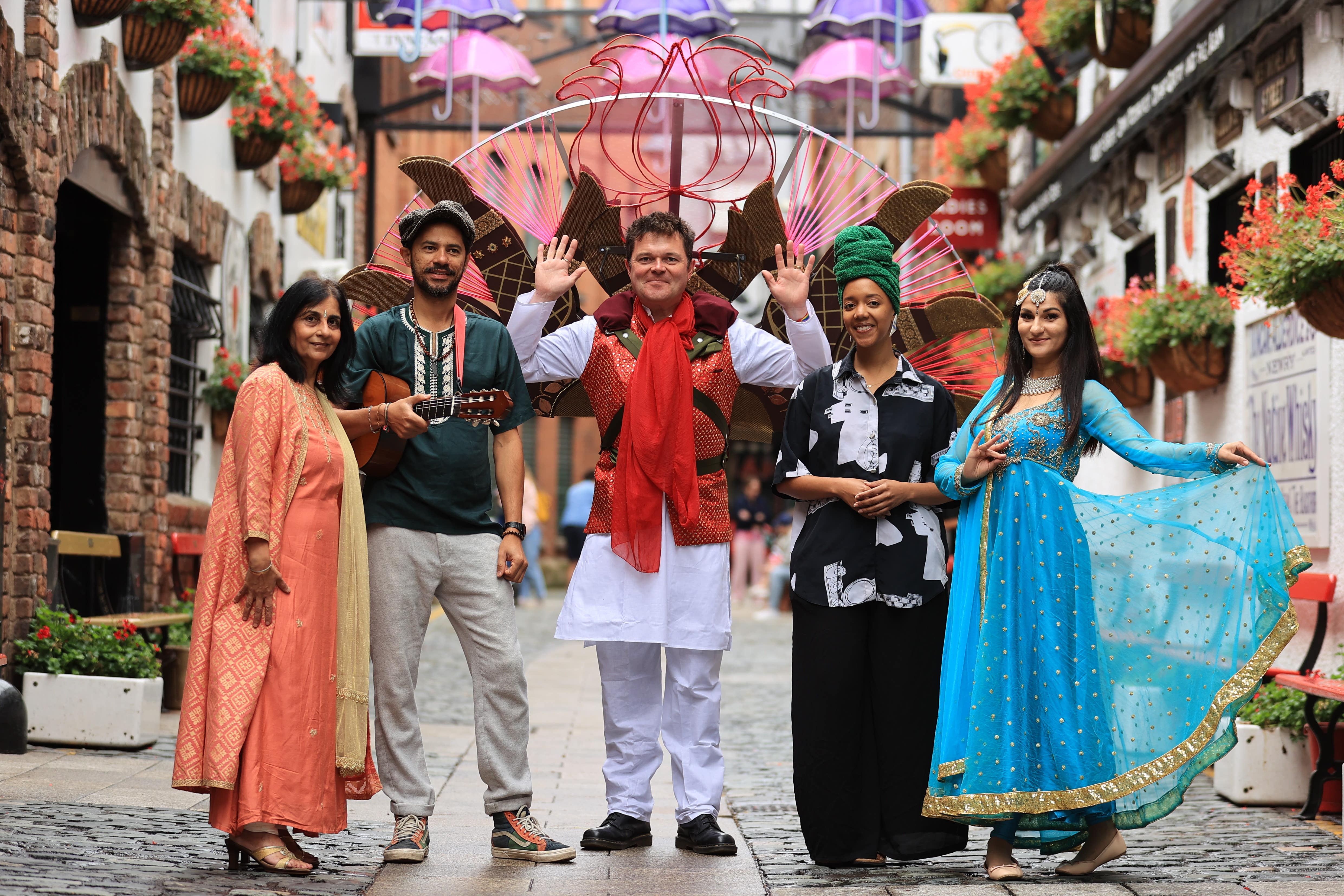 Nisha Tandon CEO of ArtsEkta, Israh Castro from Utropiks, Stephen Begg performer, Yamara Lone from Utropiks and Leyla Gallius (ArtsEkta dancer) at the launch of the Belfast Mela Festival at Commercial court in Belfast (PA)