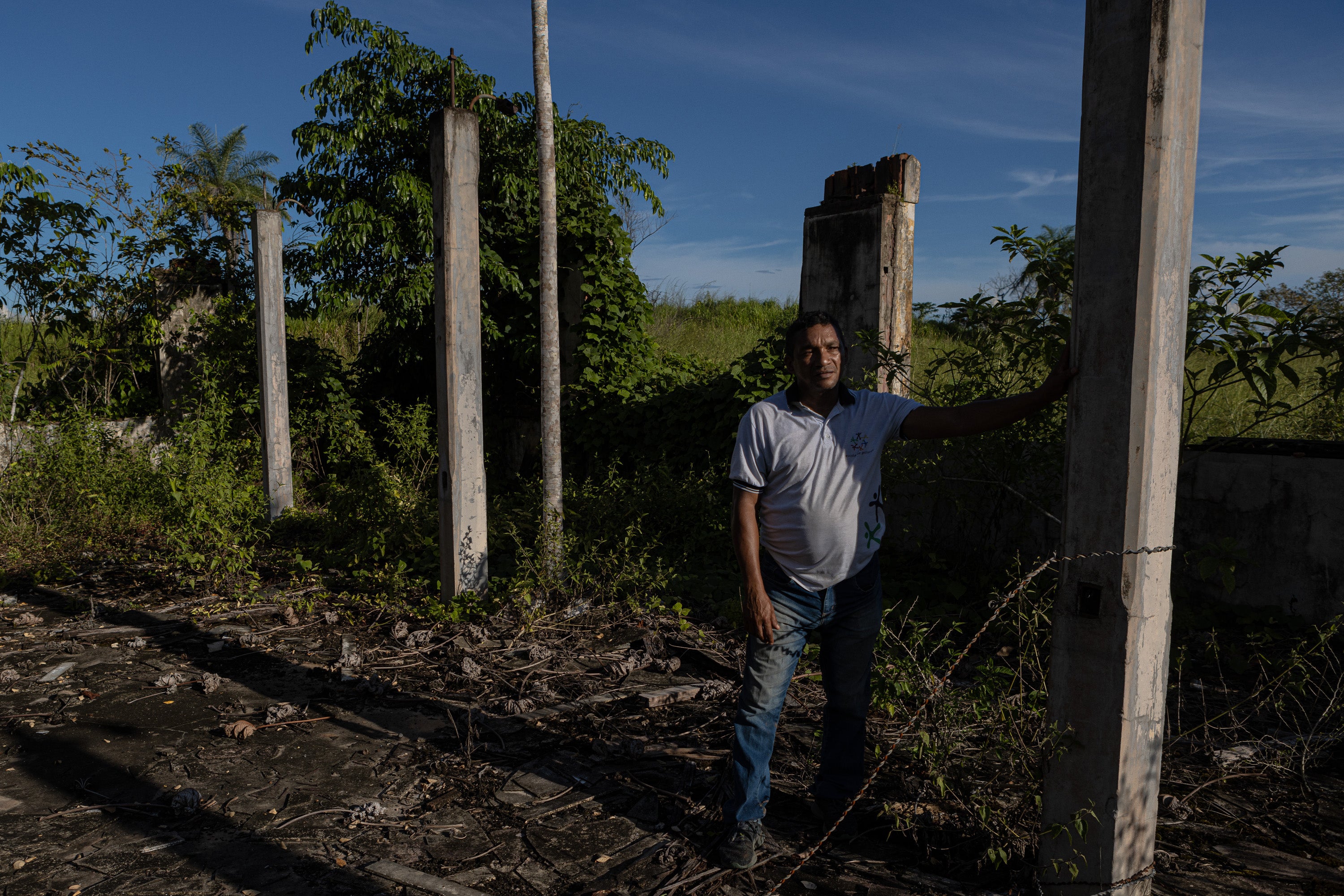 Luiz Magno Ribeiro, a schoolteacher and the town historian of Fordlândia, Brazil, stands in what’s left of a hospital where his father worked as a chauffeur for an American doctor