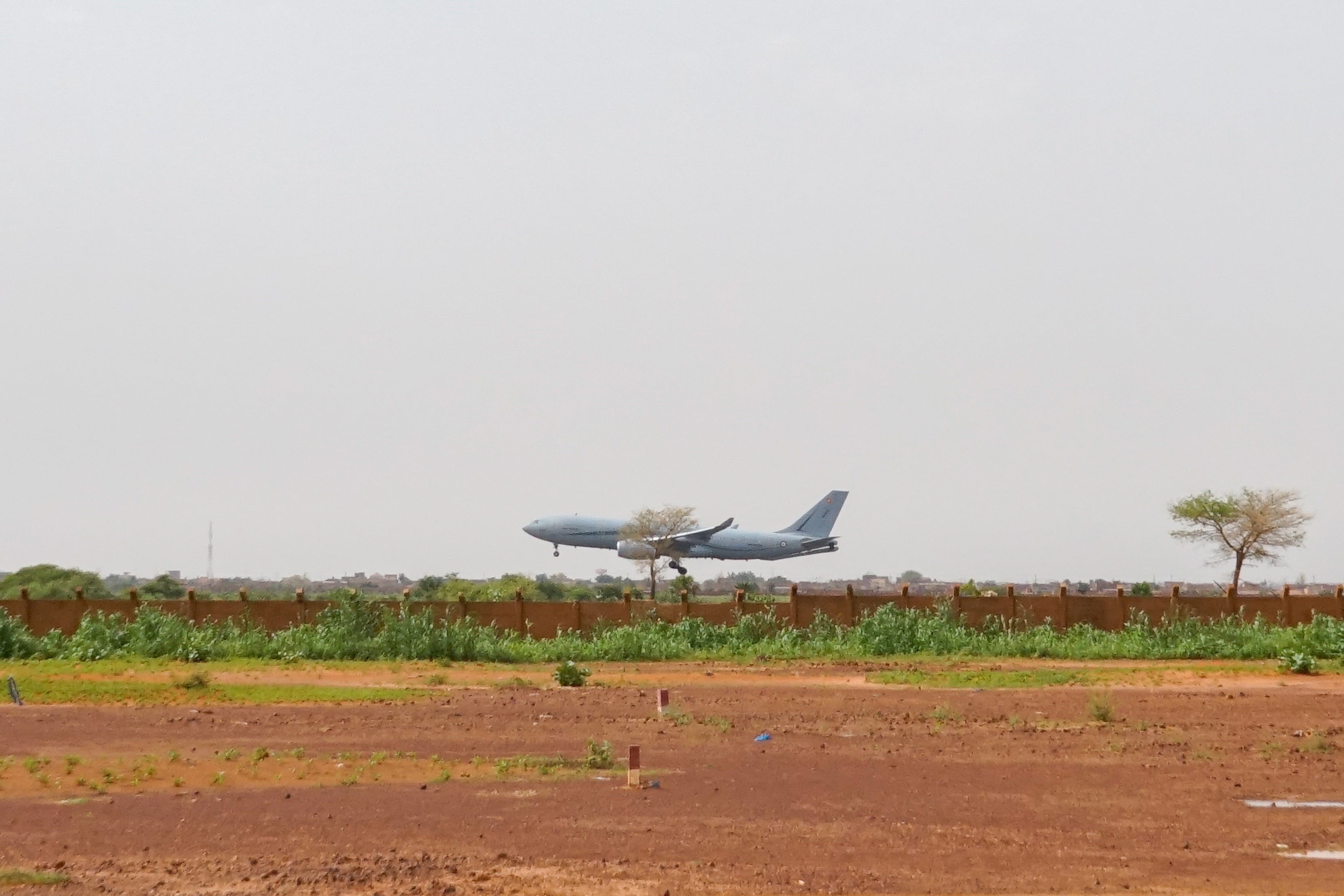 A French military aircraft lands at Diori Hamani airport on Tuesday