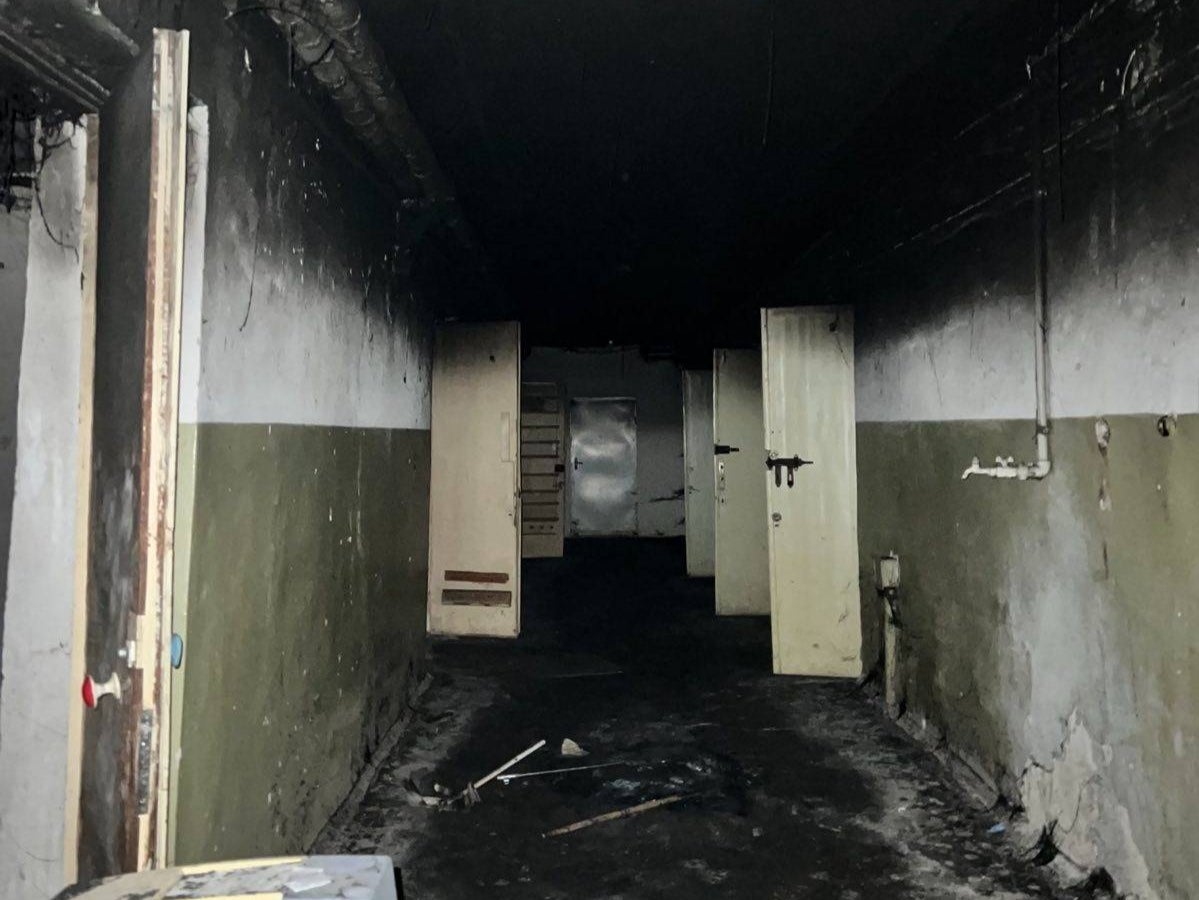 A corridor in one detention centre fleeing Russians attempted to burn to hide evidence, prosecutors allege