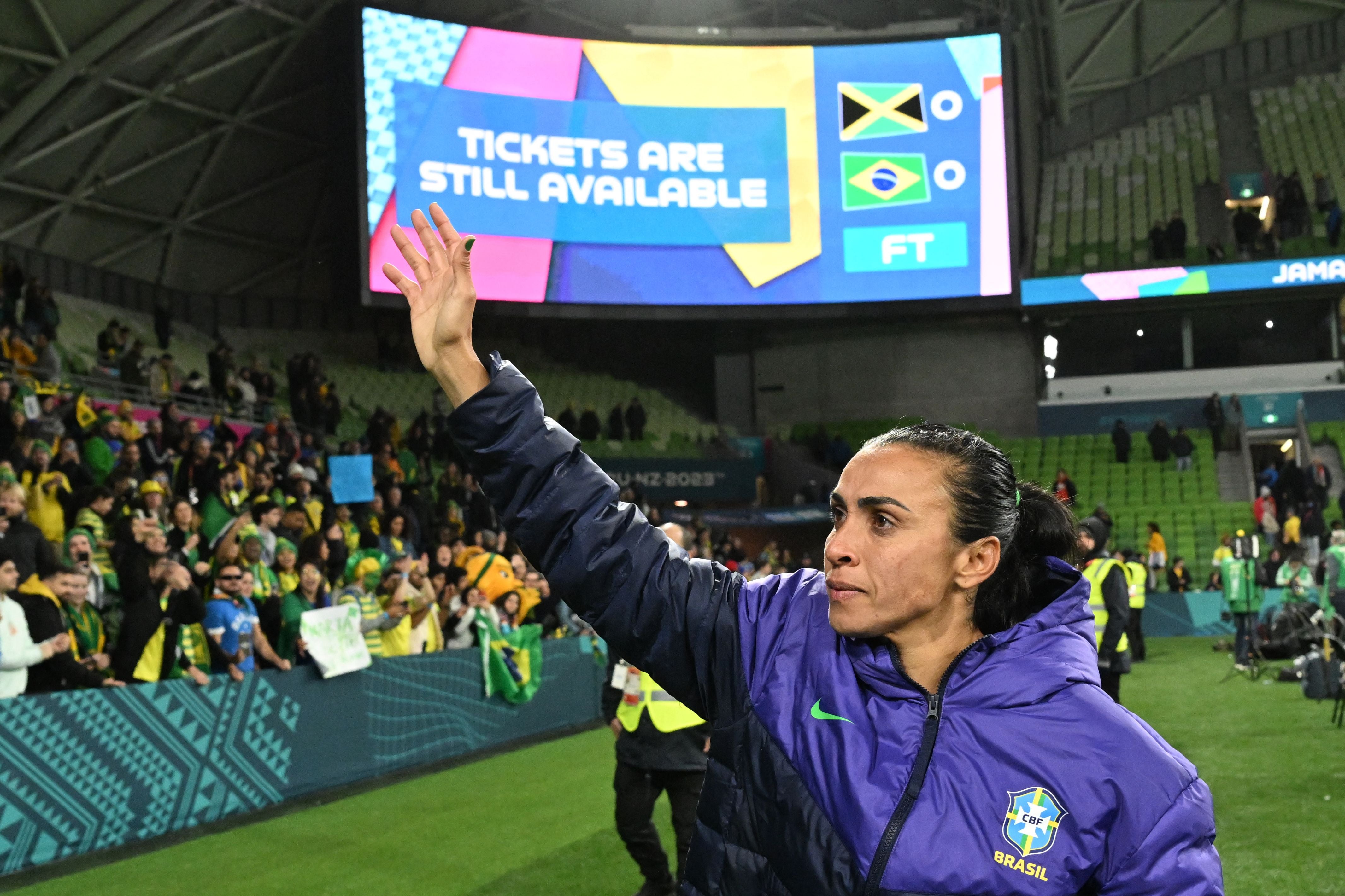 Marta waves to the crowd after Brazil are eliminated from the World Cup