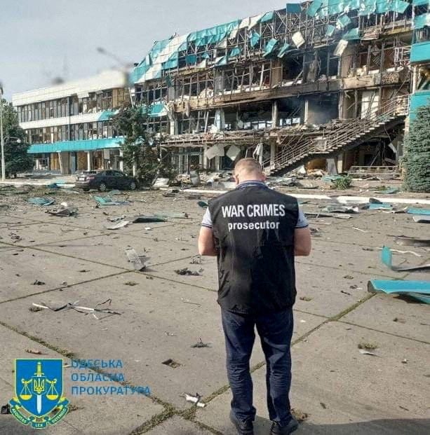 An inspector surveys the damage at a grain port facility in, Izmail, southern Ukraine