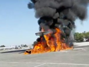 The wreckage of a small plane burns on a runway at Van Nuys Airport, in Los Angeles, California, on 2 August, 2023