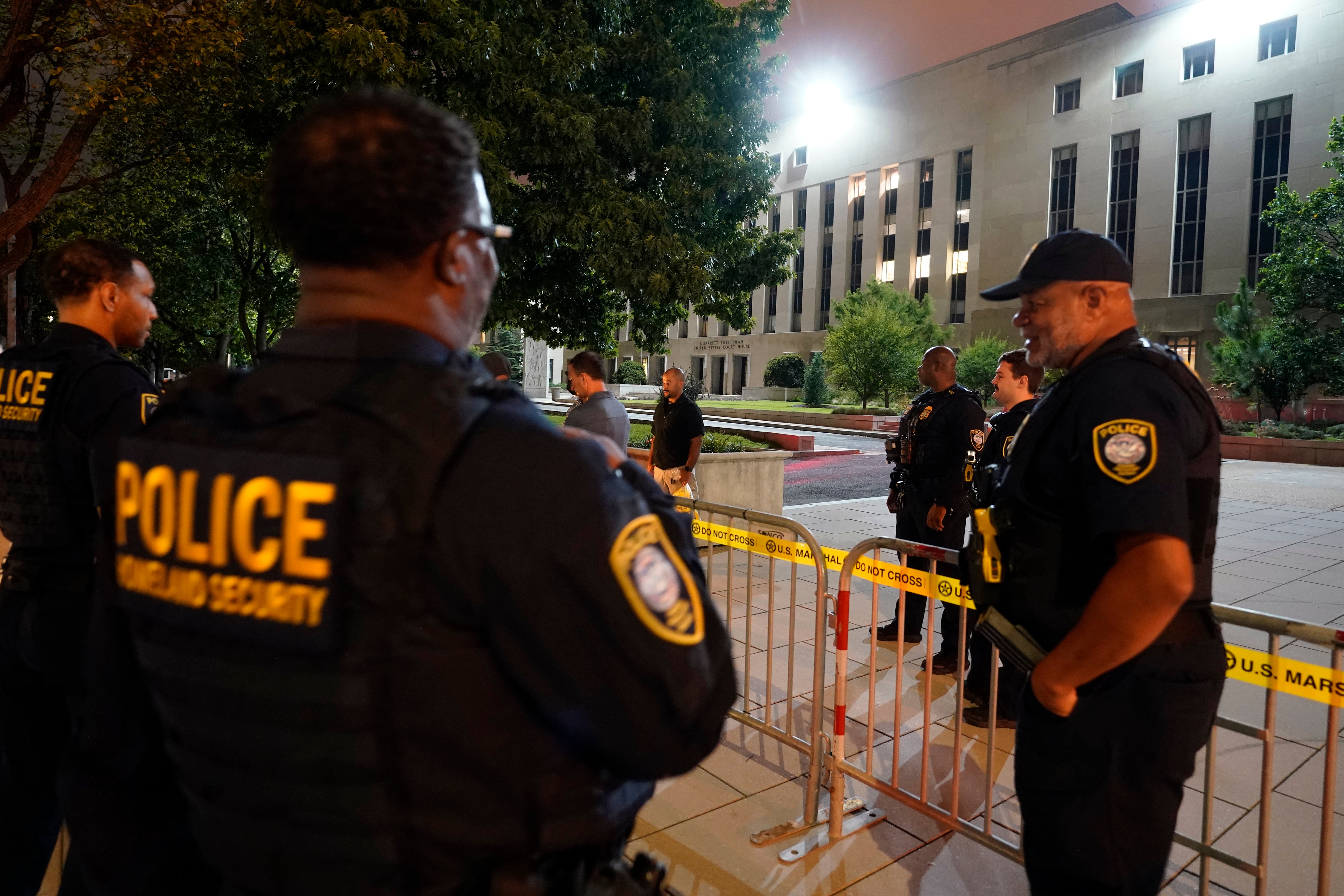 Department of Homeland Security workers outside the DC courthouse