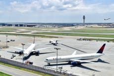 Passenger presses broken glass against flight attendant’s neck and threatens to ‘cut off her head’