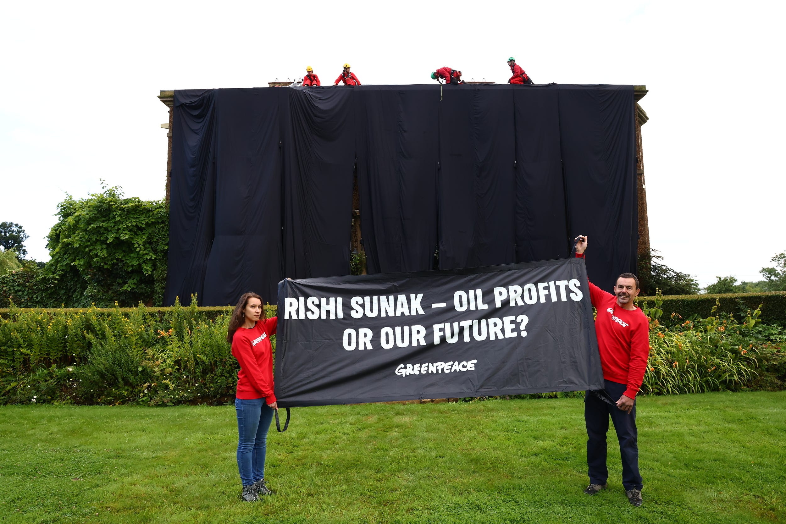 Greenpeace activists climbing at the home of Prime Minister Rishi Sunak