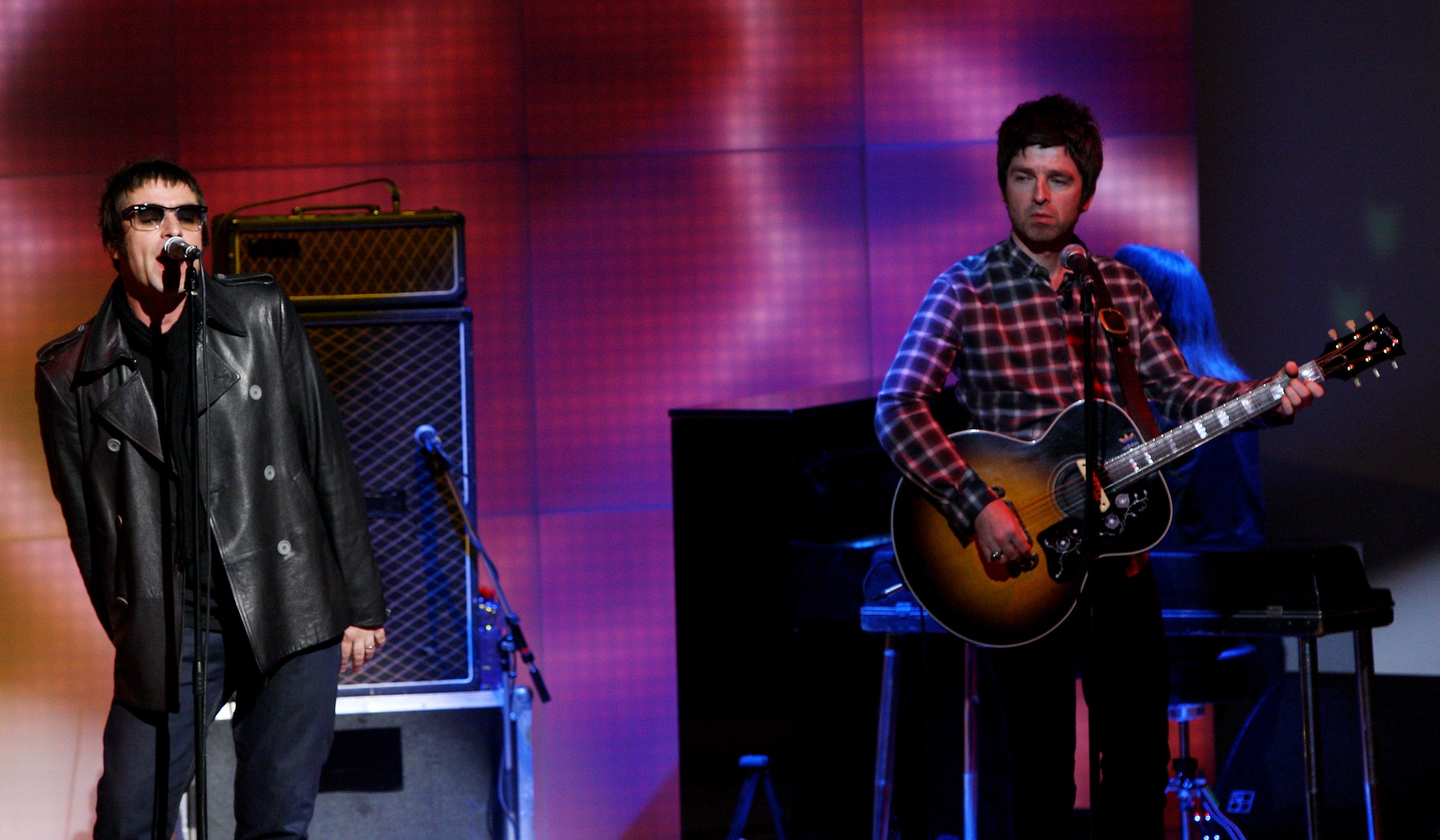 Noel and Liam on stage in 2008, a year before Oasis split