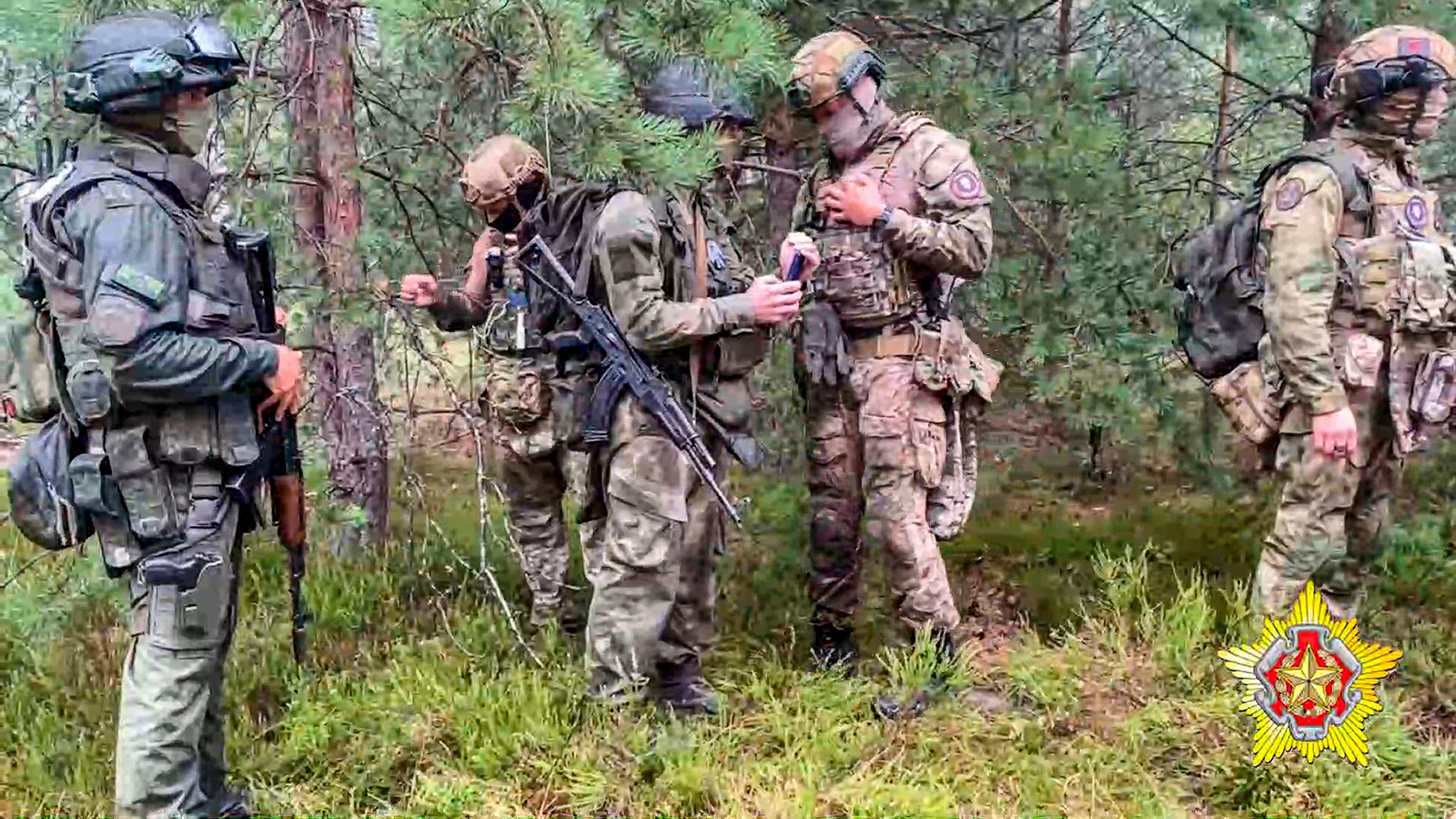 Belarusian soldiers of the Special Operations Forces (SOF) and mercenary fighters from Wagner private military company attend maneuvers at a firing range near the border city of Brest