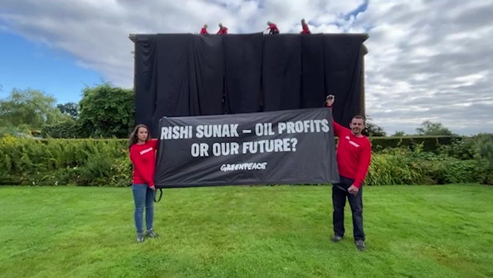 Greenpeace activists climbed Rishi Sunak's Yorkshire home to stage protest on his roof